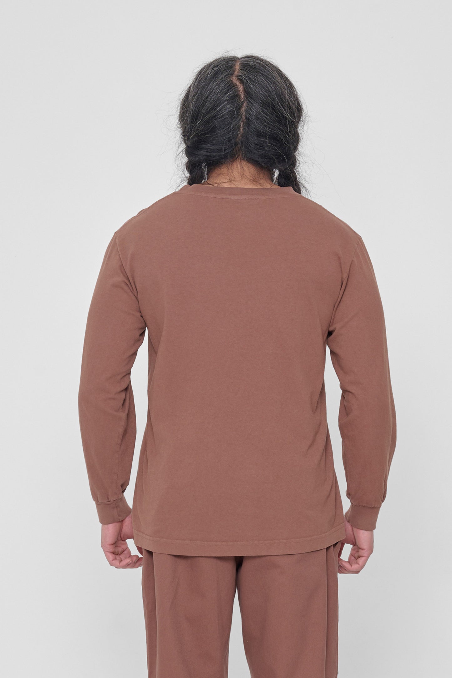 Back view showing fabric drape and relaxed fit throughout.