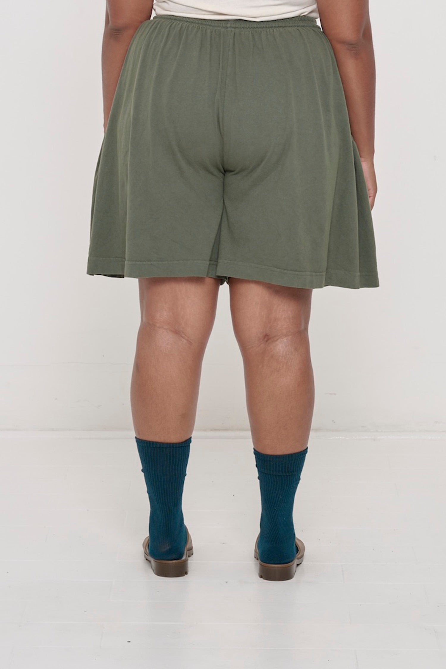Back close-up on Pine Long Tubular Shorts highlighting the relaxed fit.