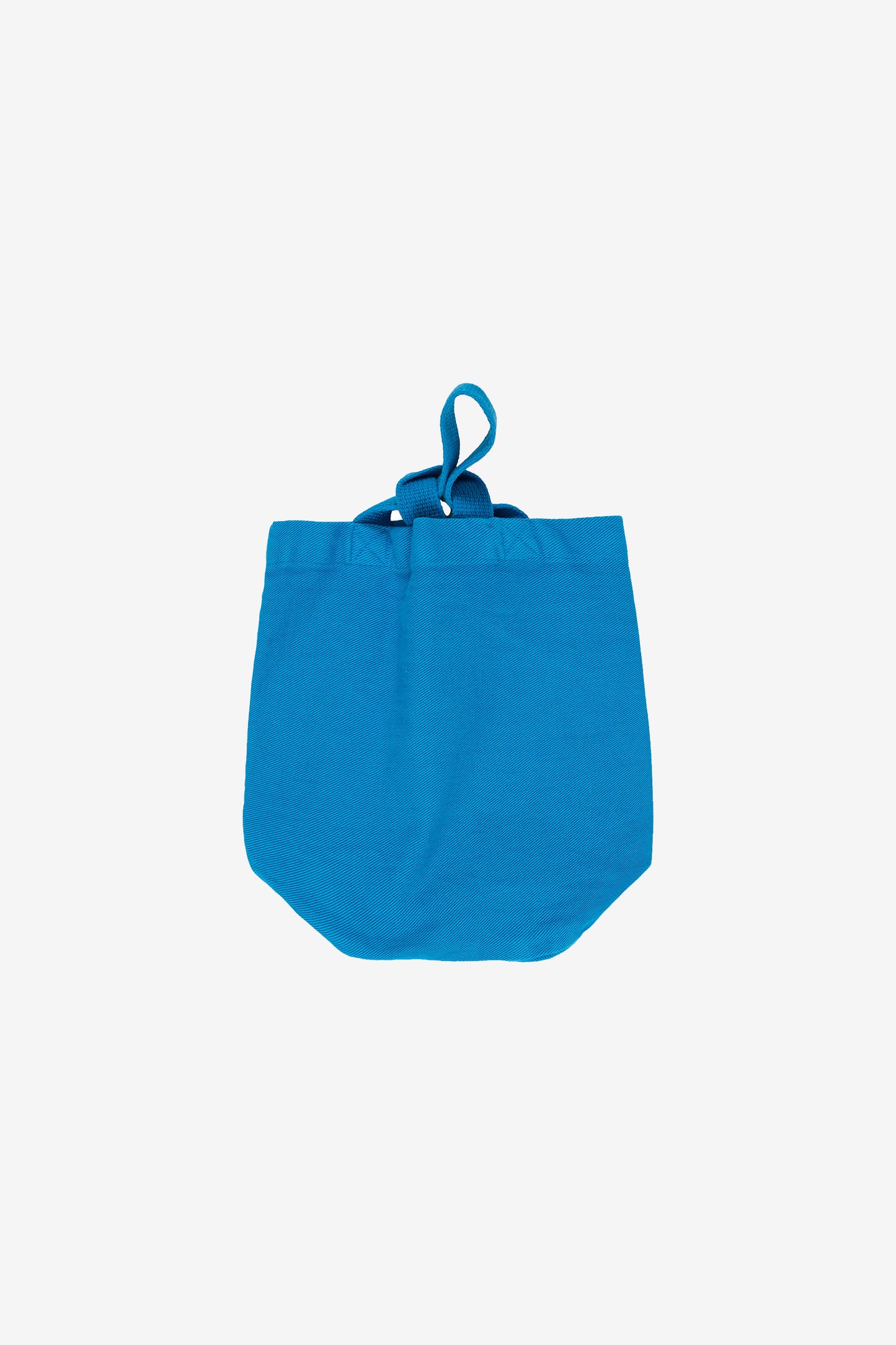 Flat lay of handle strap looped through shorter strap. 