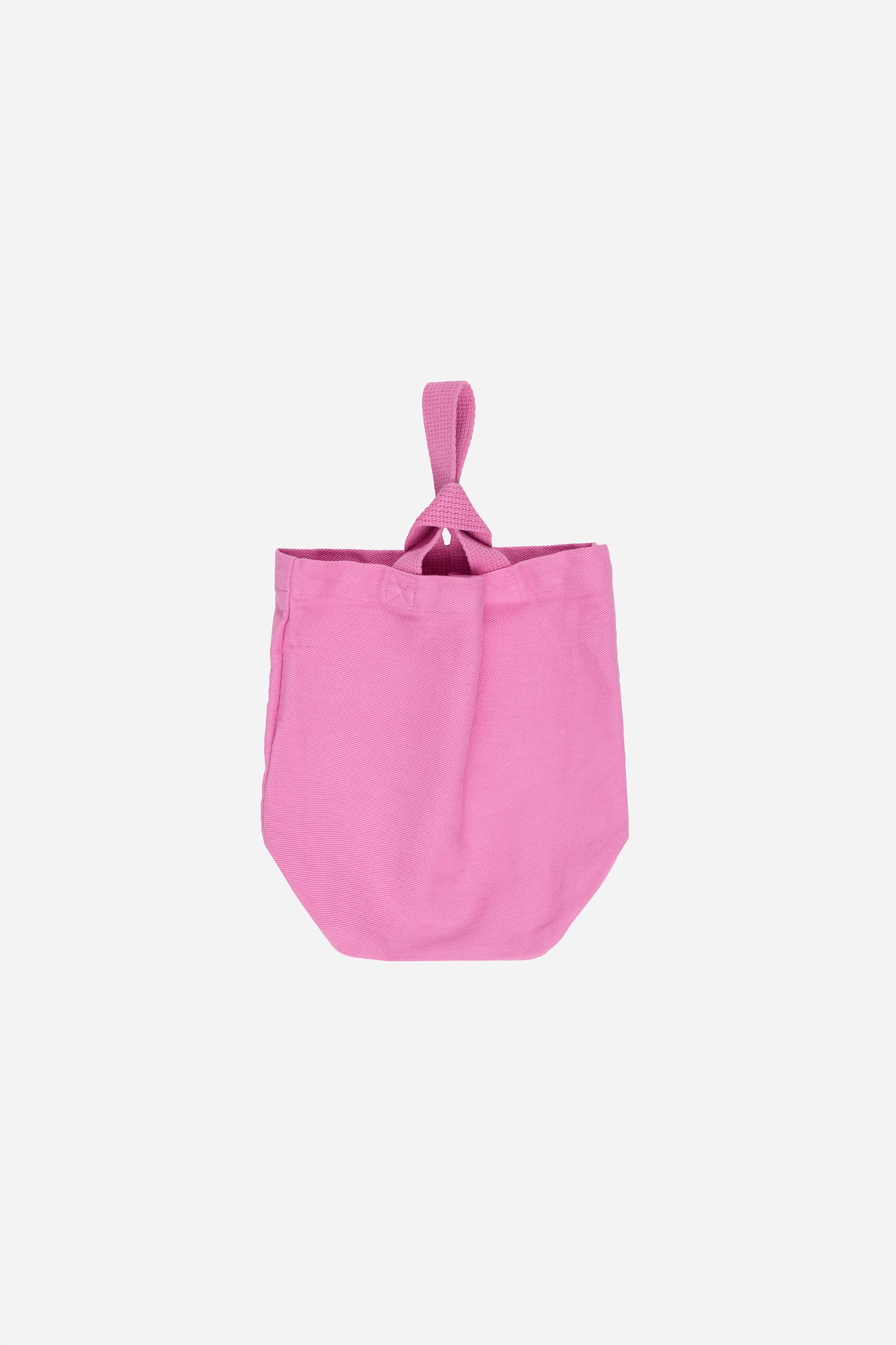 Flat lay of Pixie Loop Tote showing shorter and longer straps interlocking closure.