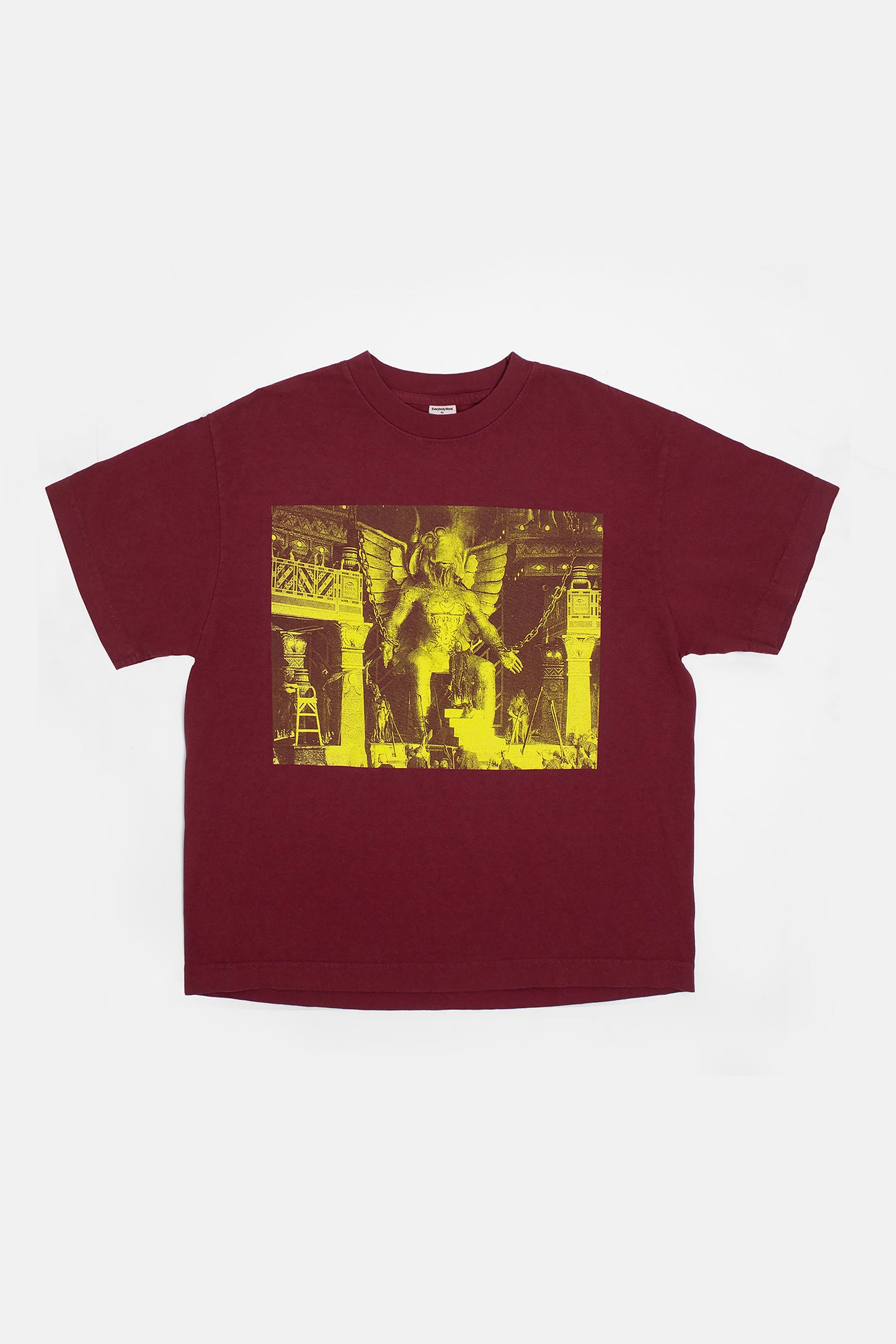 Flat lay showing the graphic and square-like boxy cut of the t-shirt.