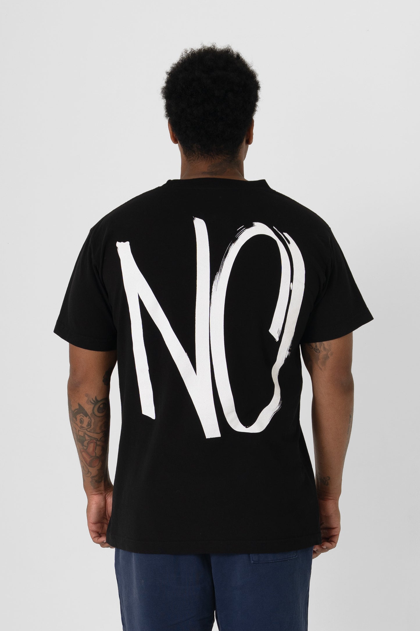 Back view showing "NO graphic and relaxed fit throughout