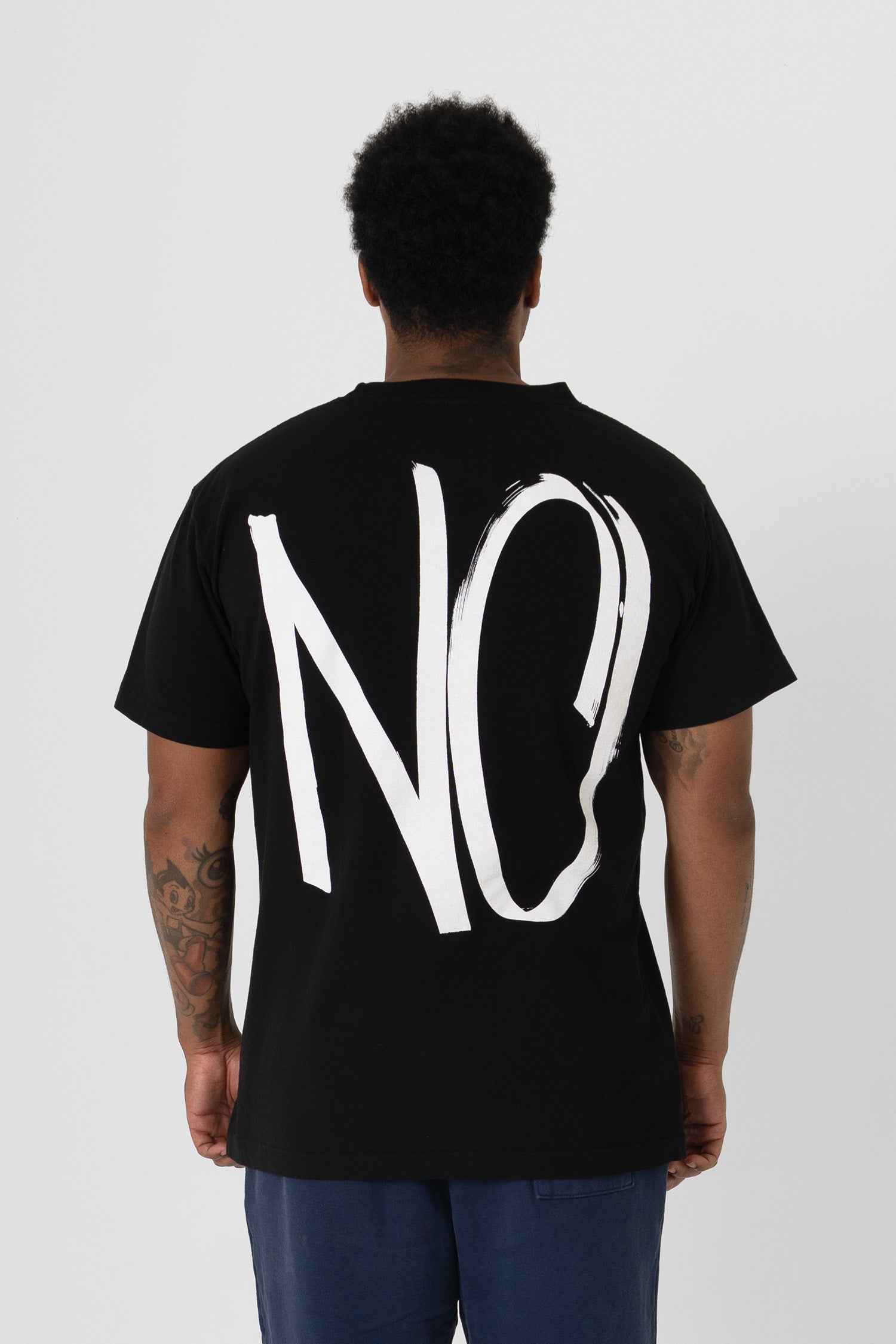 Back view showing "NO graphic and relaxed fit throughout