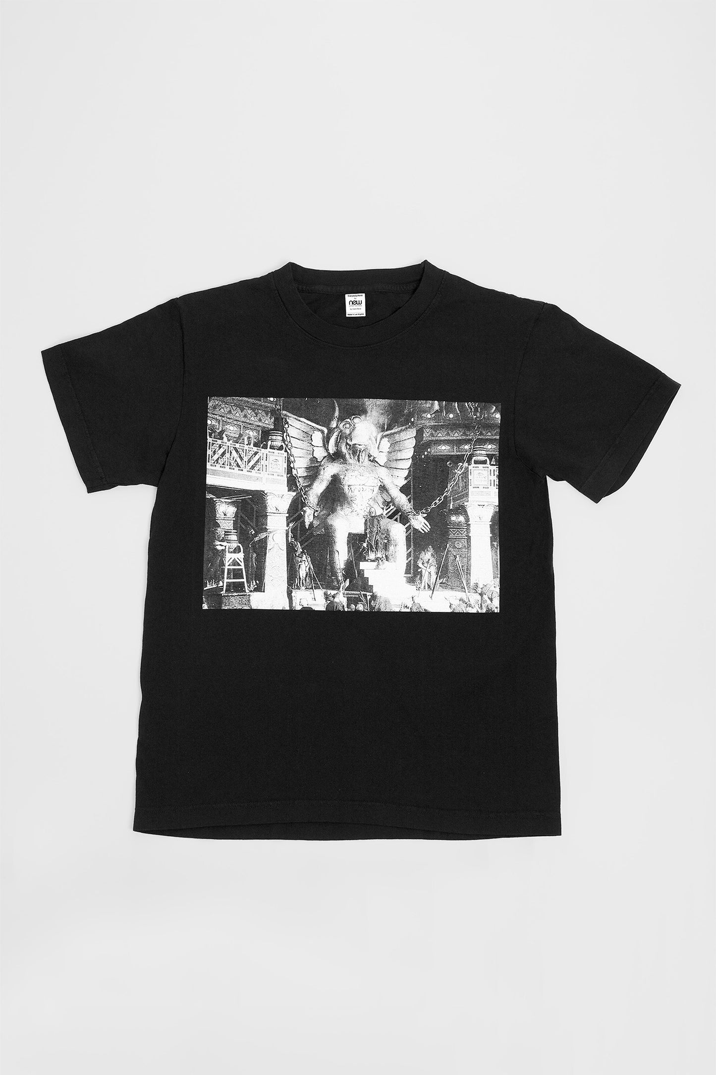 Flat lay showing the graphic and straight rectangular cut of the body.