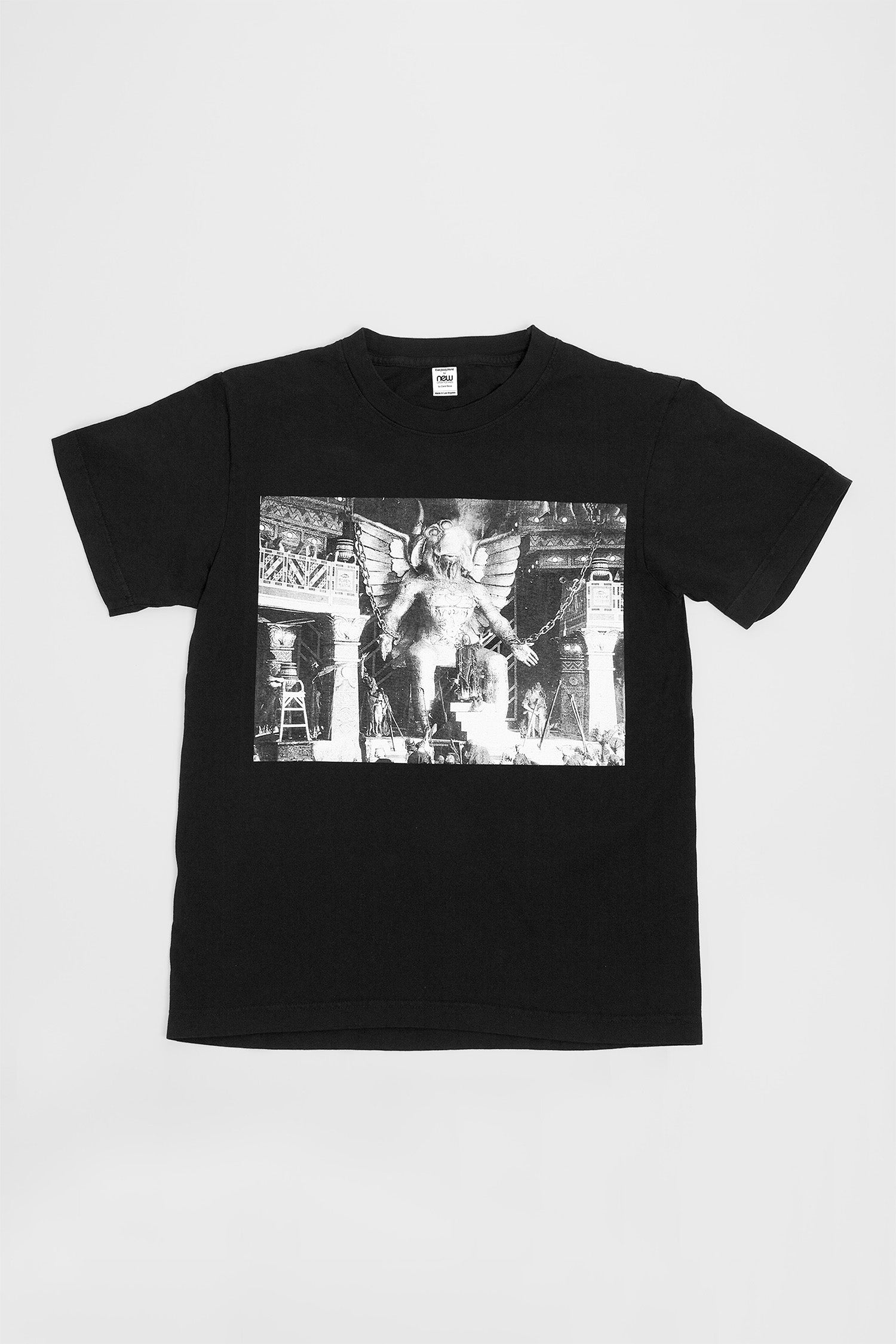 Flat lay showing the graphic and straight rectangular cut of the body.