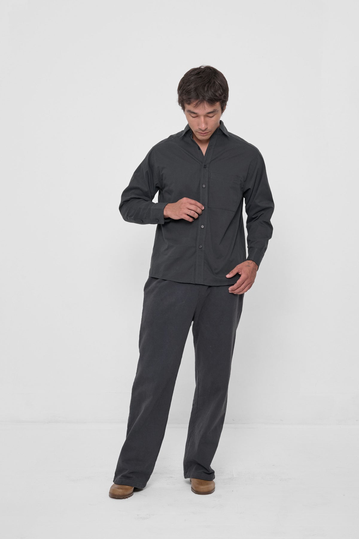 Peach Fuzz Button-Up Shirt in Slate – front view, styled with matching Apartment Pants and Plasticana shoes