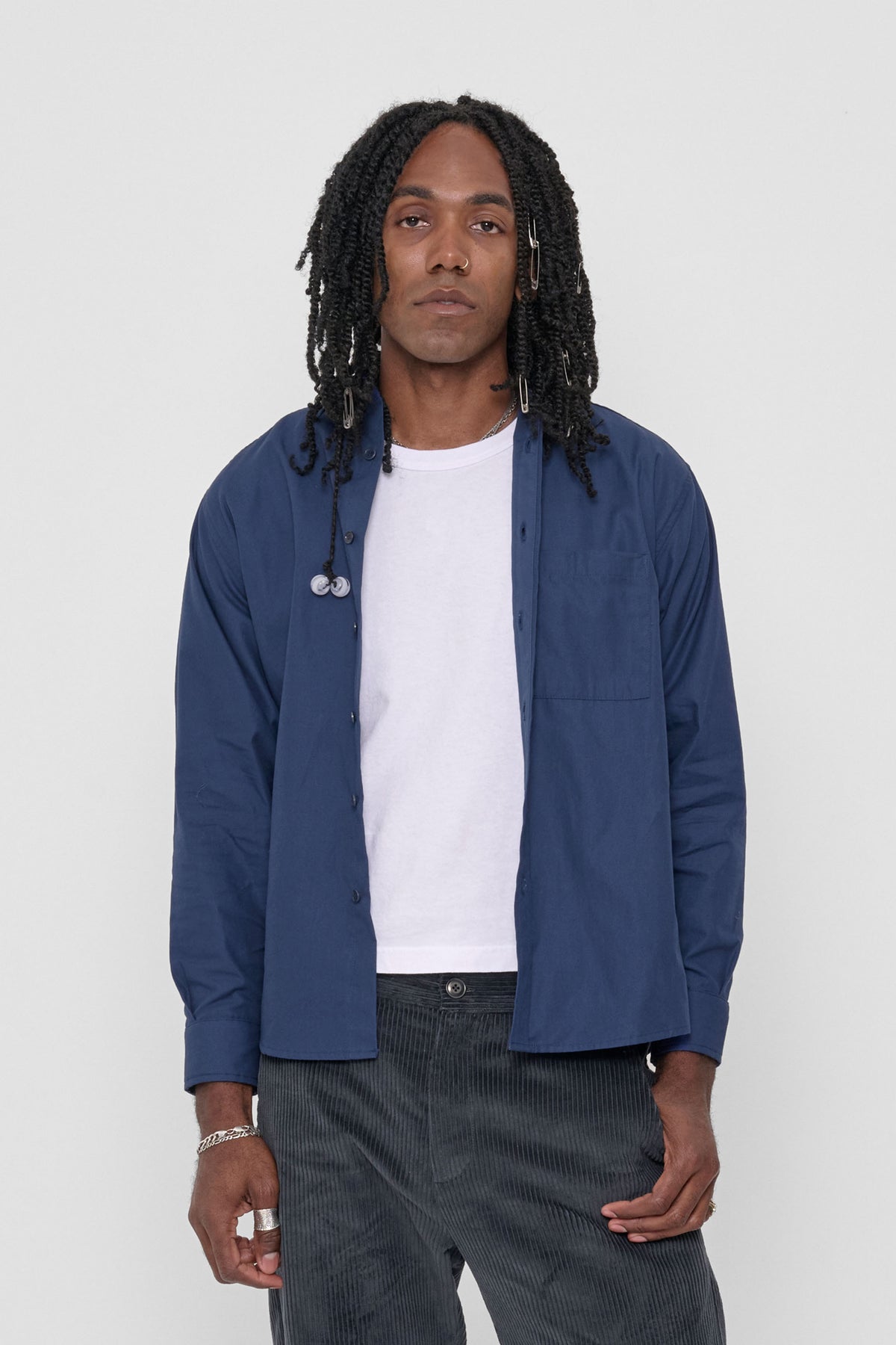 Peach Fuzz Button-Up Shirt in Washed Navy – front view on model, worn unbuttoned over a white tee