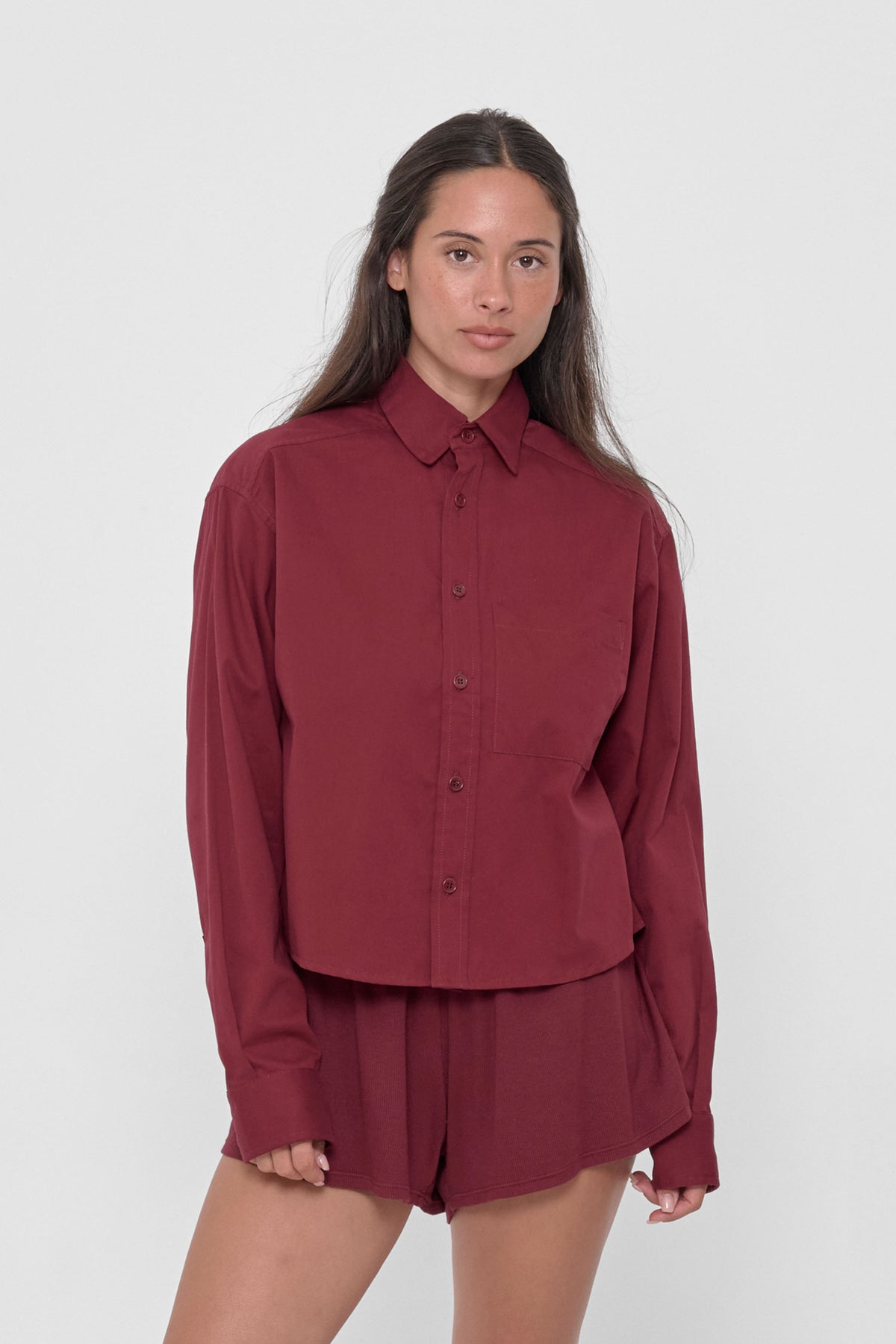 Peach Fuzz Cropped Button-Up Shirt in Garnet – front view on model