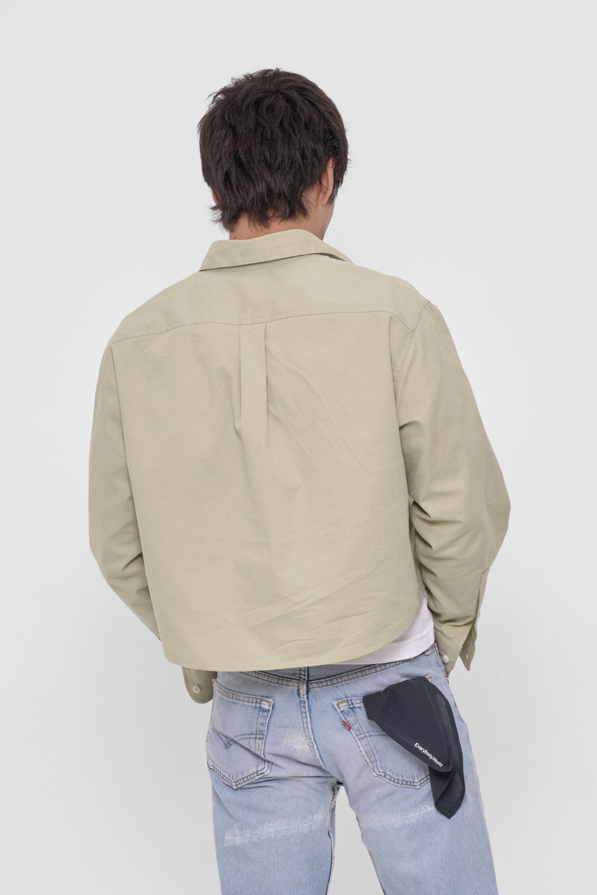 Peach Fuzz Cropped Button-Up Shirt in Oat – back view on model
