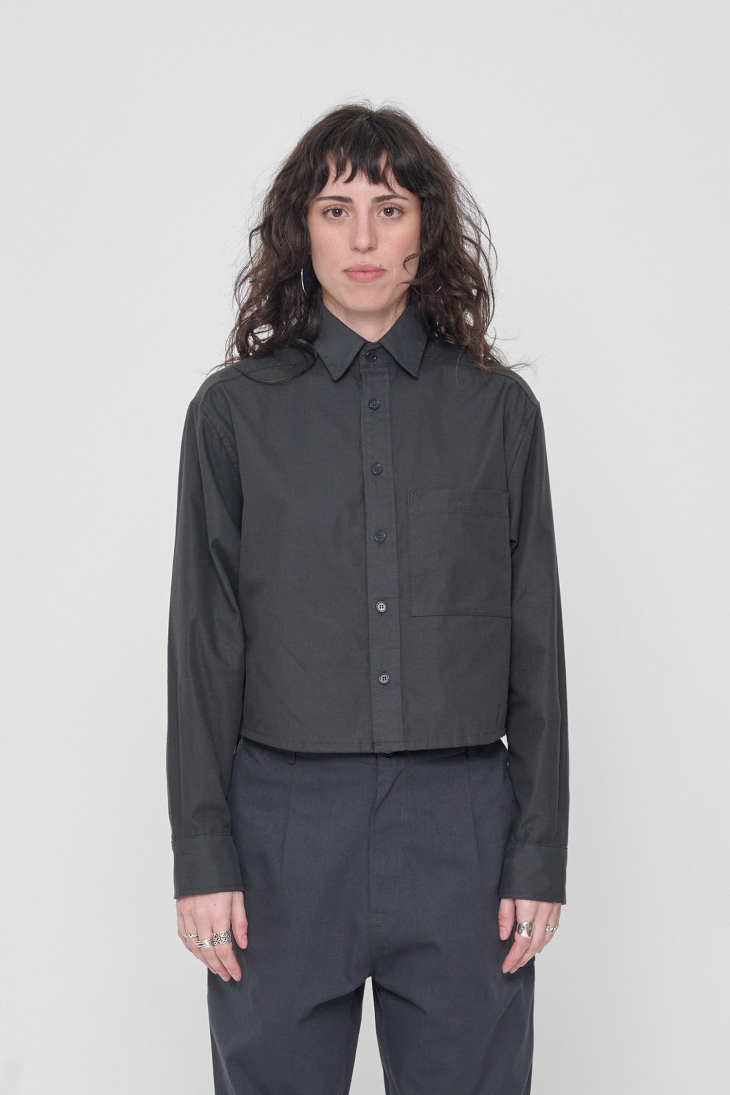5'6" model wearing size S Slate Peach Fuzz Cropped Button Up Shirt. Bottom hem hits at waist. 