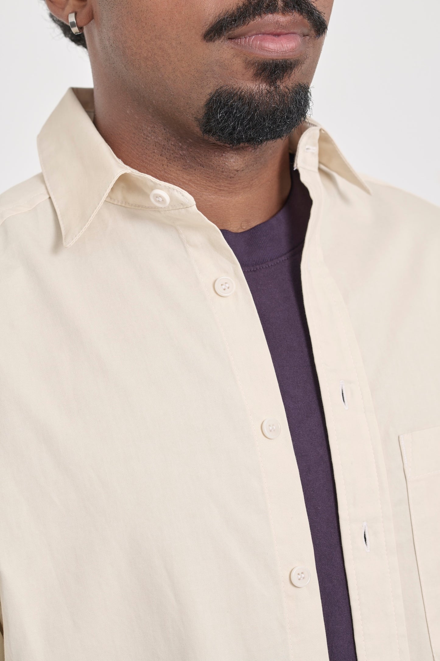 Zoom in on Oat Peach Fuzz Twill Button-Up Shirt, highlighting the top buttons and collar. 