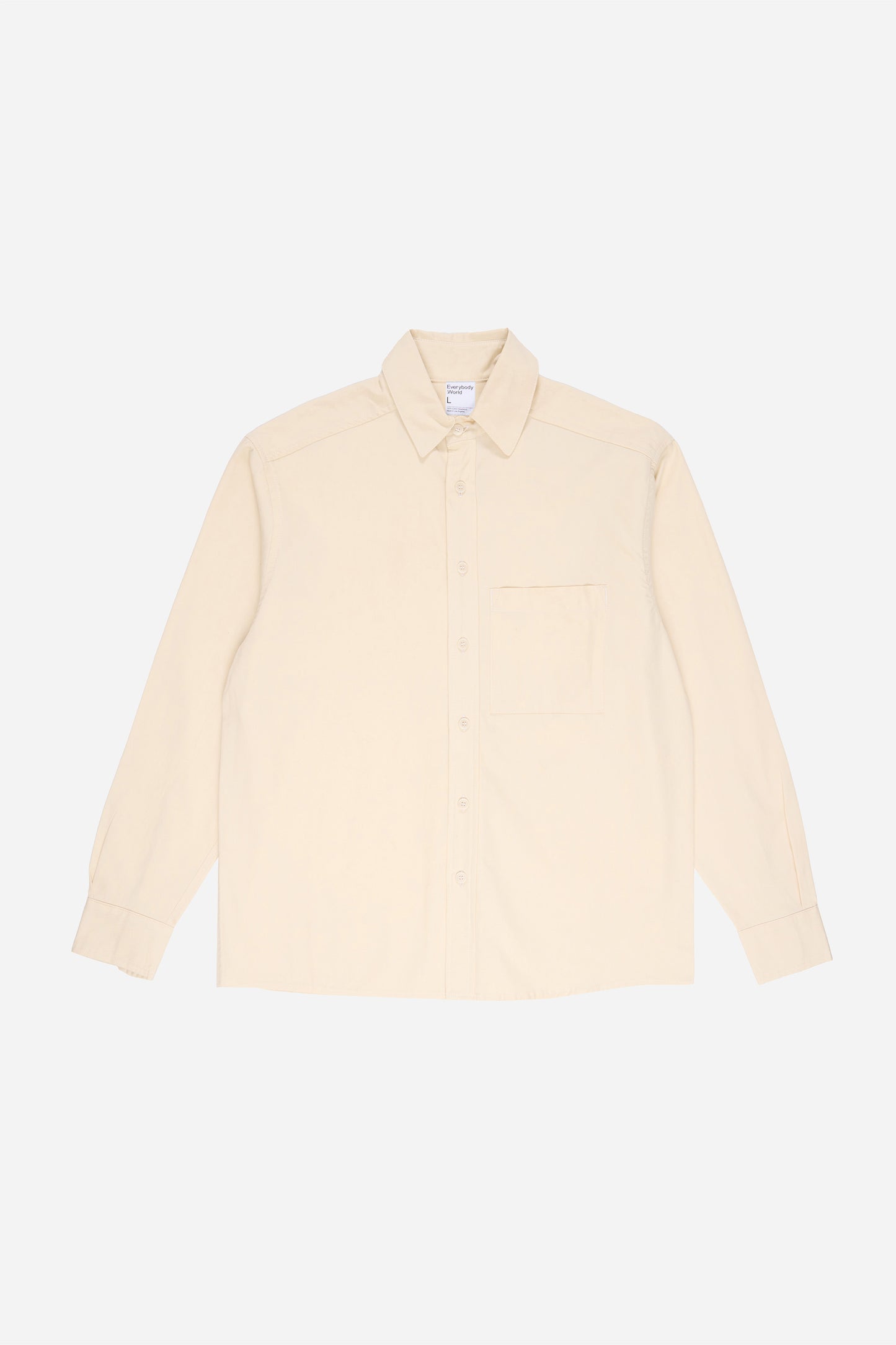 Flat lay of Oat buttoned up Peach Fuzz Twill Button-Up Shirt, front view.