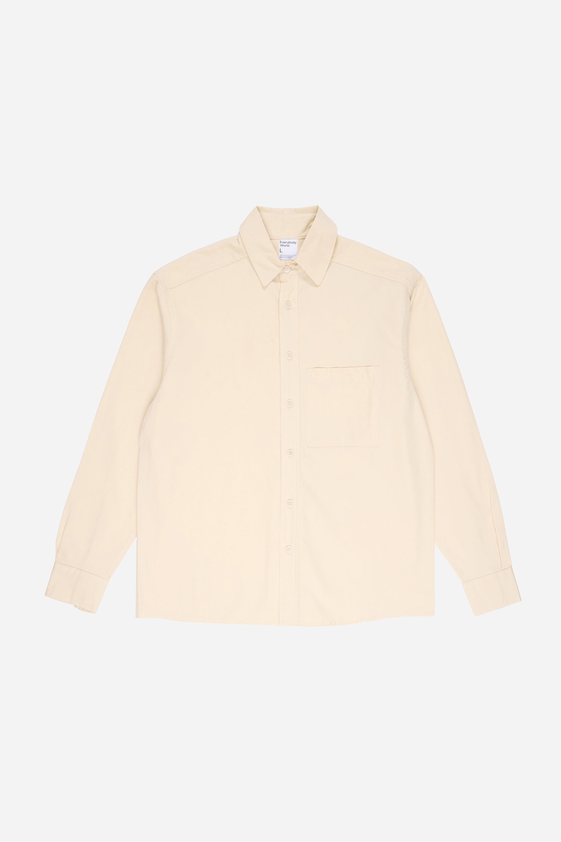 Flat lay of Oat buttoned up Peach Fuzz Twill Button-Up Shirt, front view.