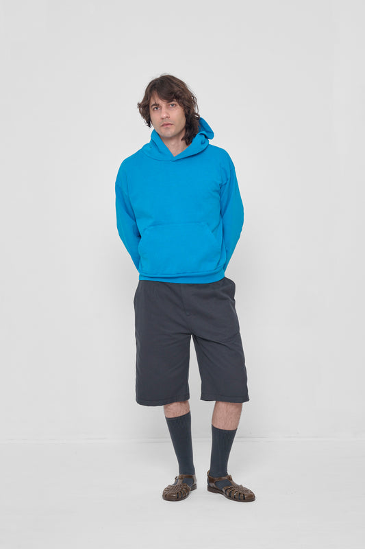 Styled with a Trash Hoodie and Bermuda Shorts.