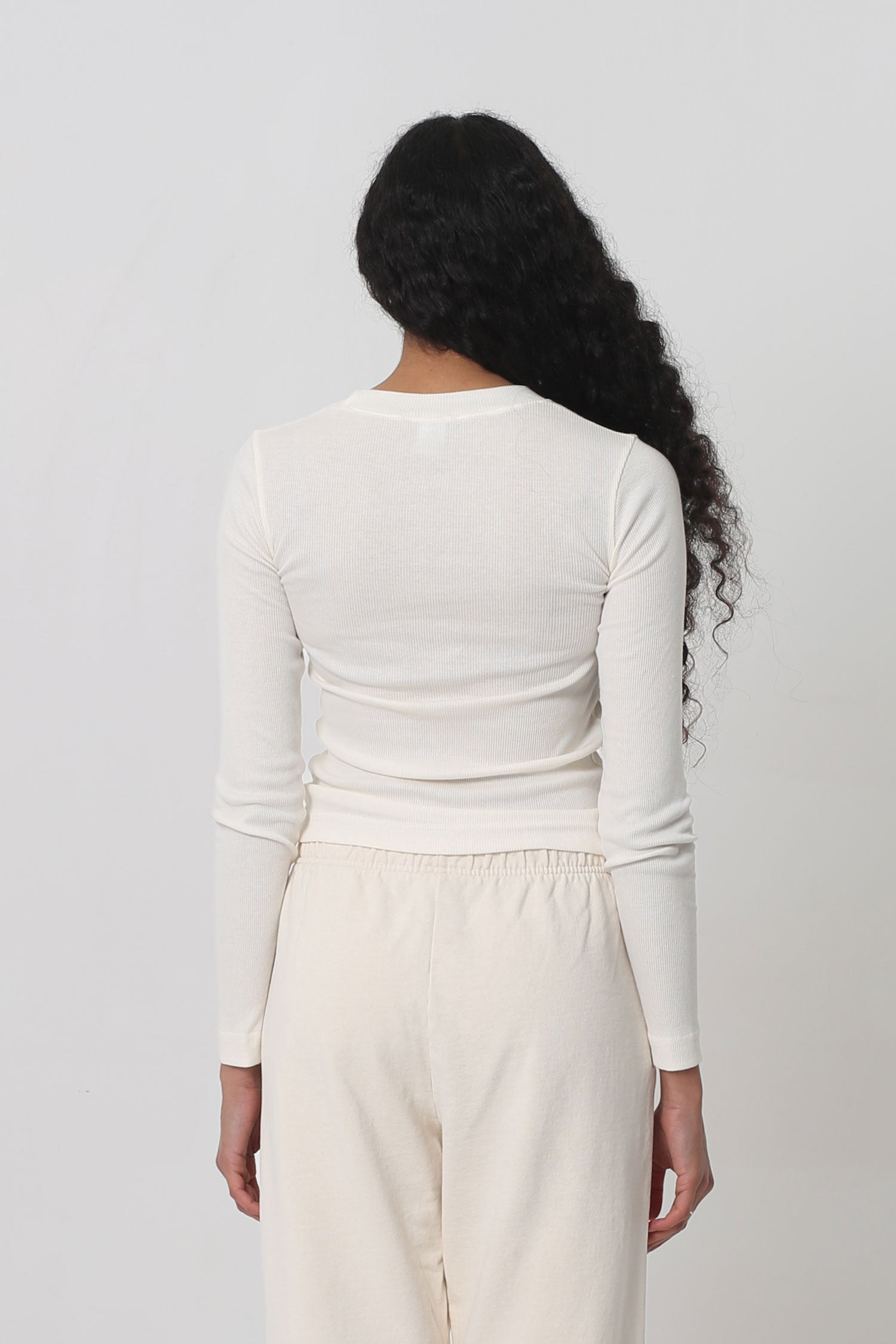 Back view: Fitted across the upper back with a little ease across the mid and lower back.