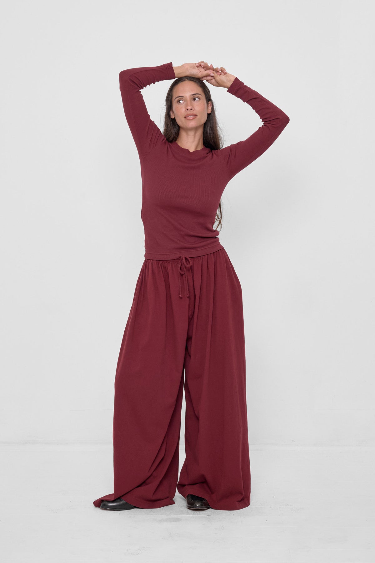 Rib Long Sleeve in Garnet – front view on model, styled with matching Tubular Pants
