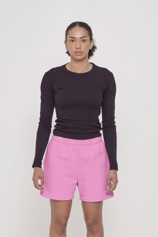 Front view of a woman wearing a Rib Long Sleeve in Mulberry with Trash Fleece Everyday Shorts in Pixie.