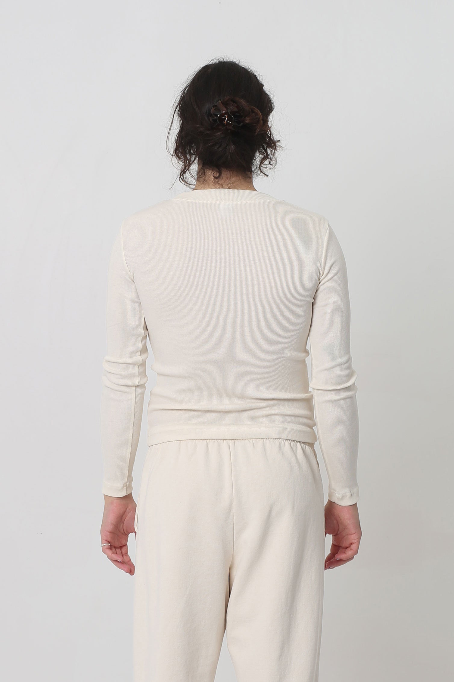 Back view: Fitted across the upper back with a little ease across lower back.