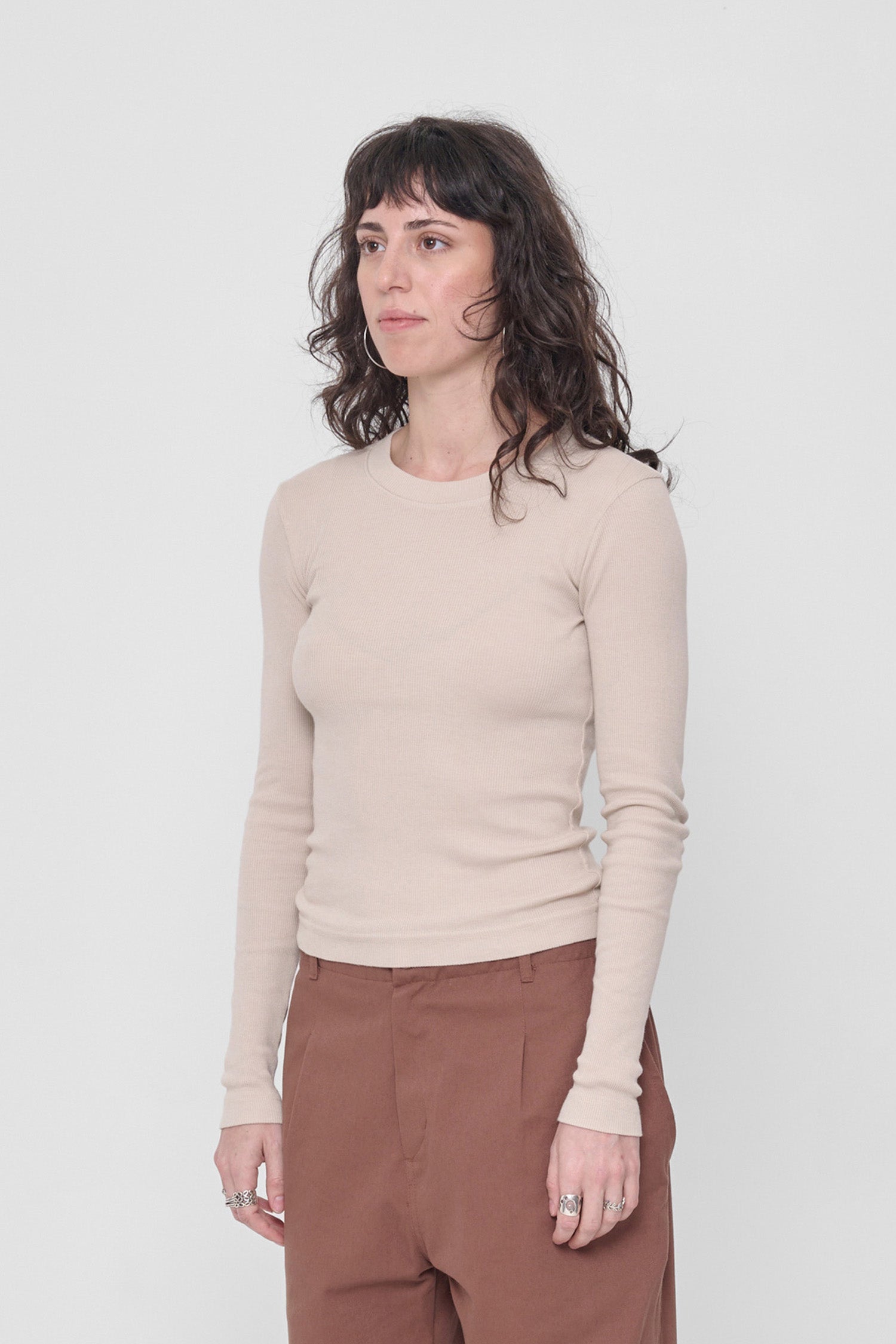 3/4 front view shows side seams and fitted silhouette.