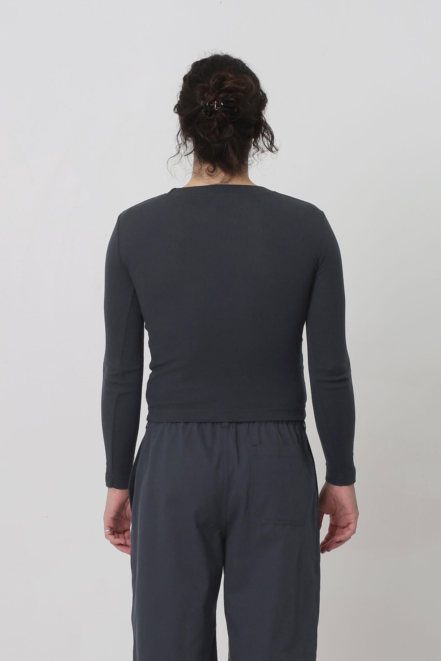 Back view showing shirt is fitted throughout.