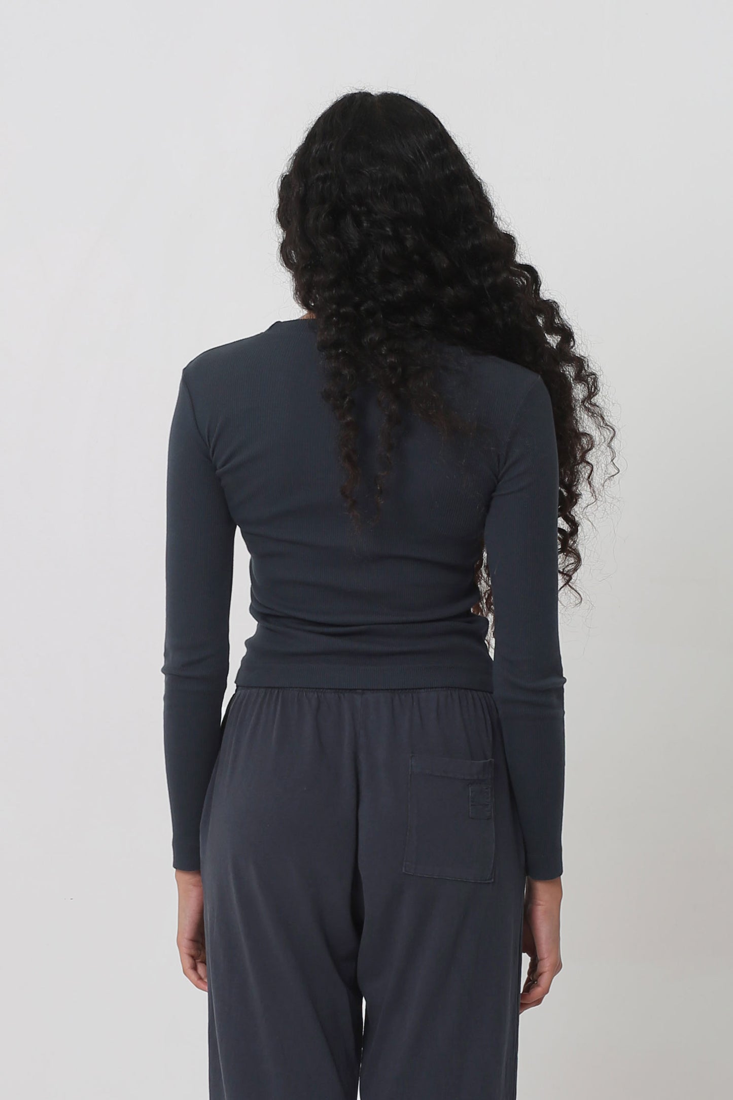 Back view: Fitted across the upper back with a little ease across the mid and lower back.