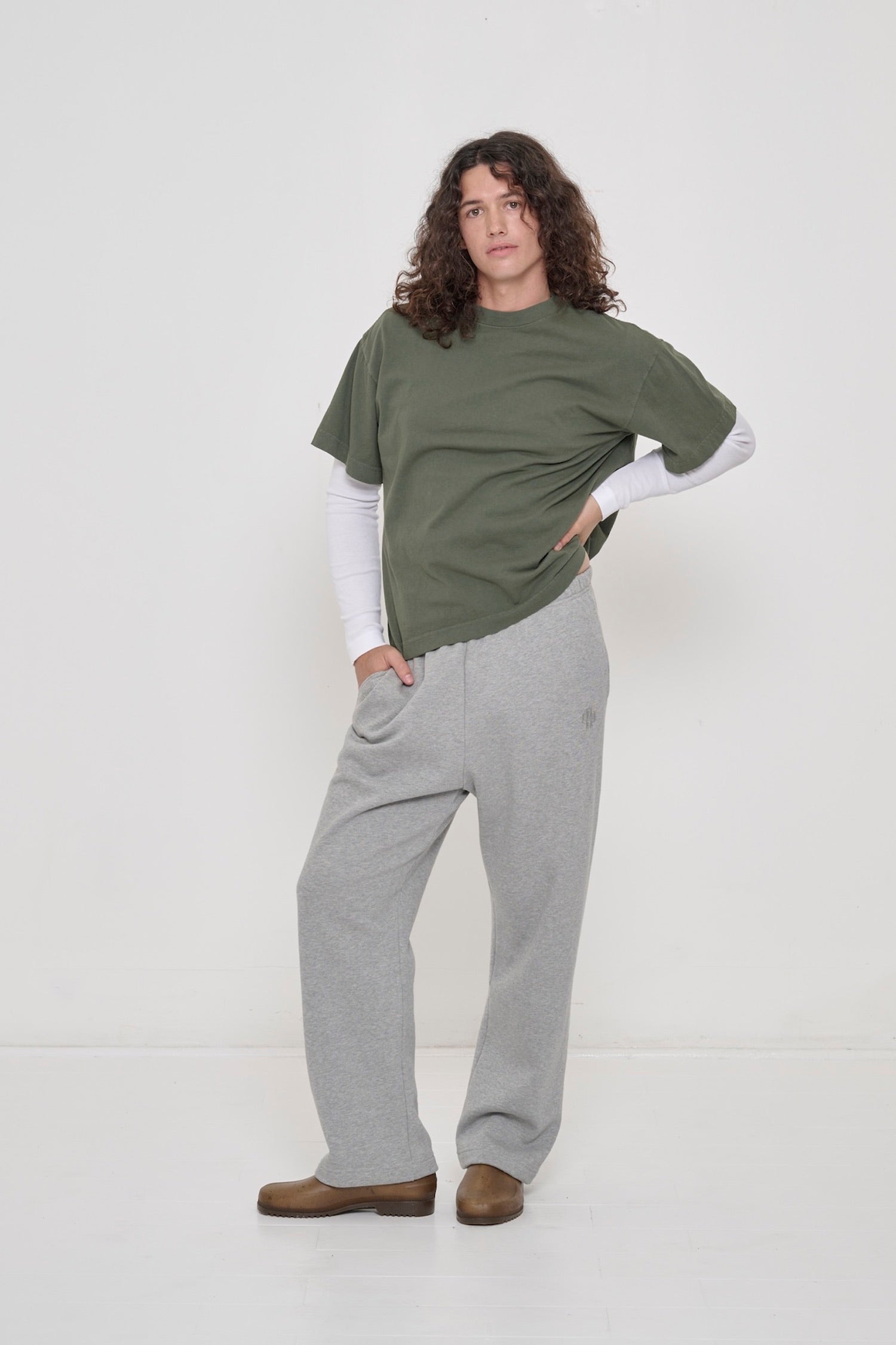 Rib Long Sleeve as a base layer: A person in a Pine Boxier Trash Tee layered over a White Rib Long Sleeve.