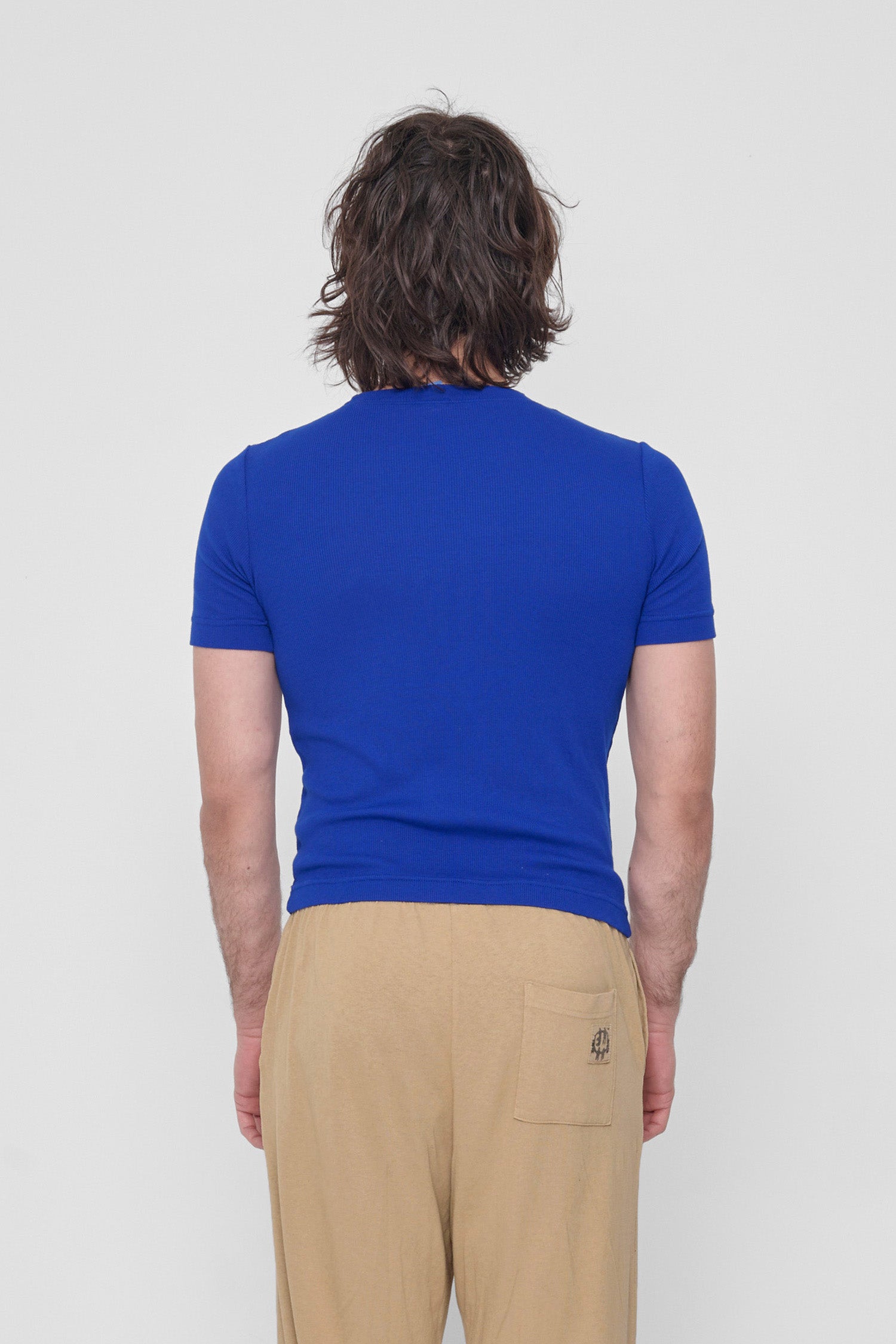 Back view showcasing the formfitting silhouette.