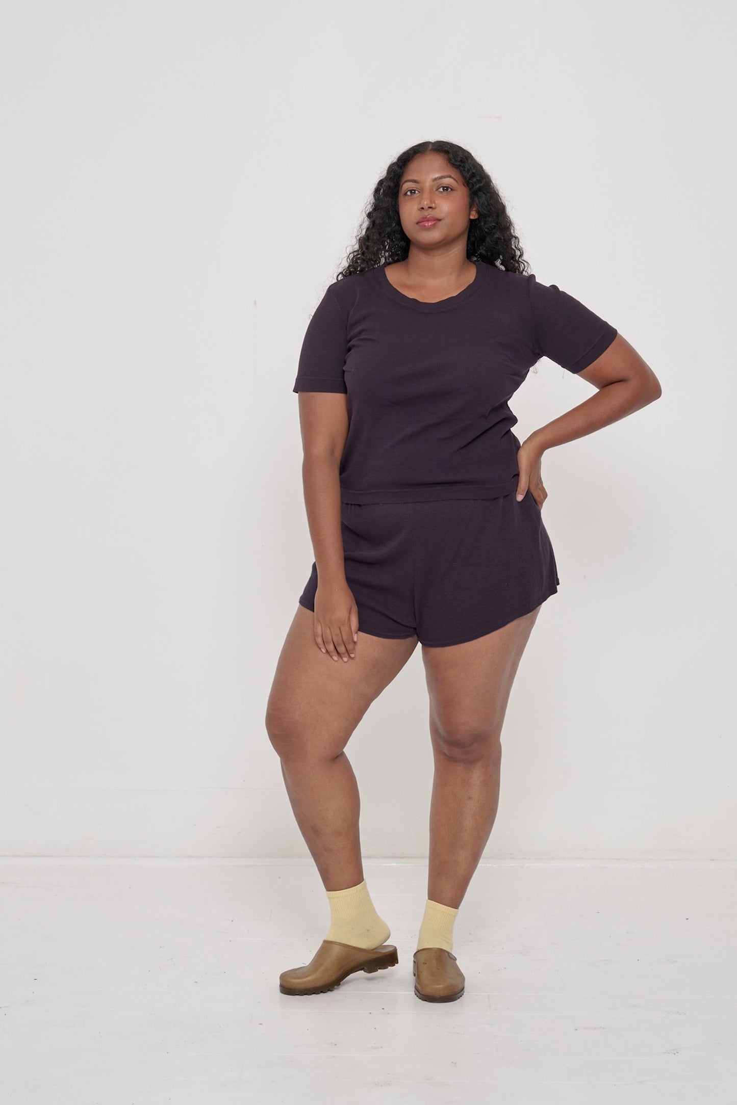 A person wearing Mulberry Rib Shorts with a matching Rib Short Sleeve.