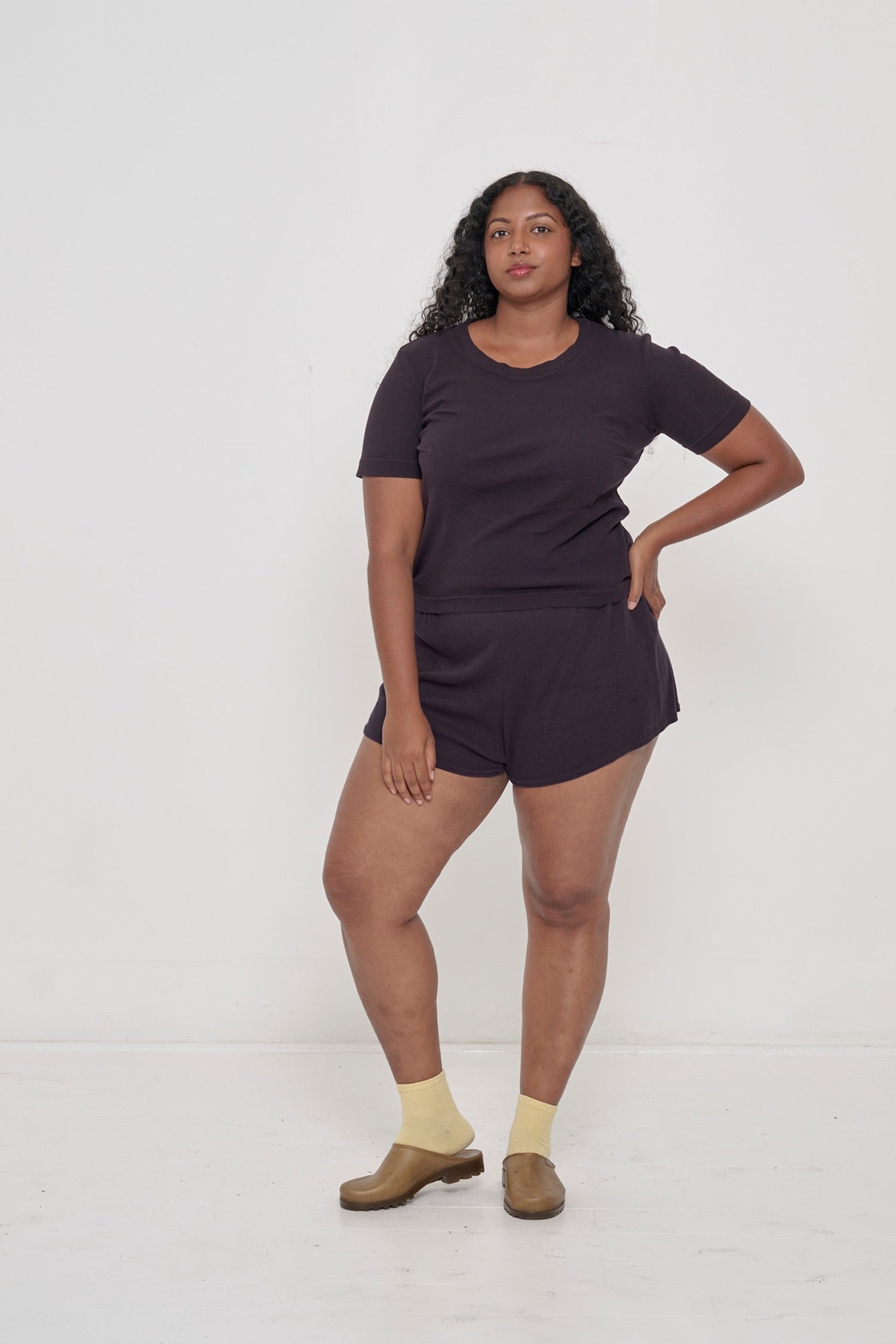 A person wearing Mulberry Rib Shorts with a matching Rib Short Sleeve.
