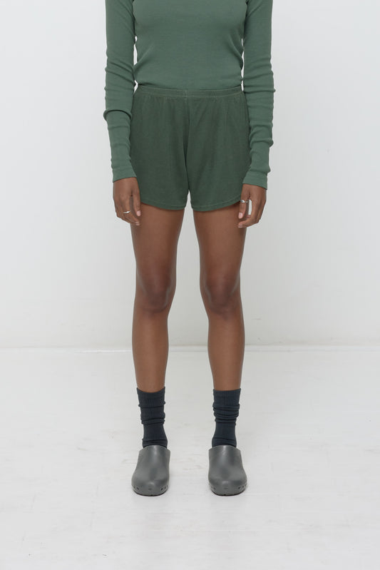 Pine Rib Shorts on model, front. Relaxed fit, upper-thigh length and elastic waist.