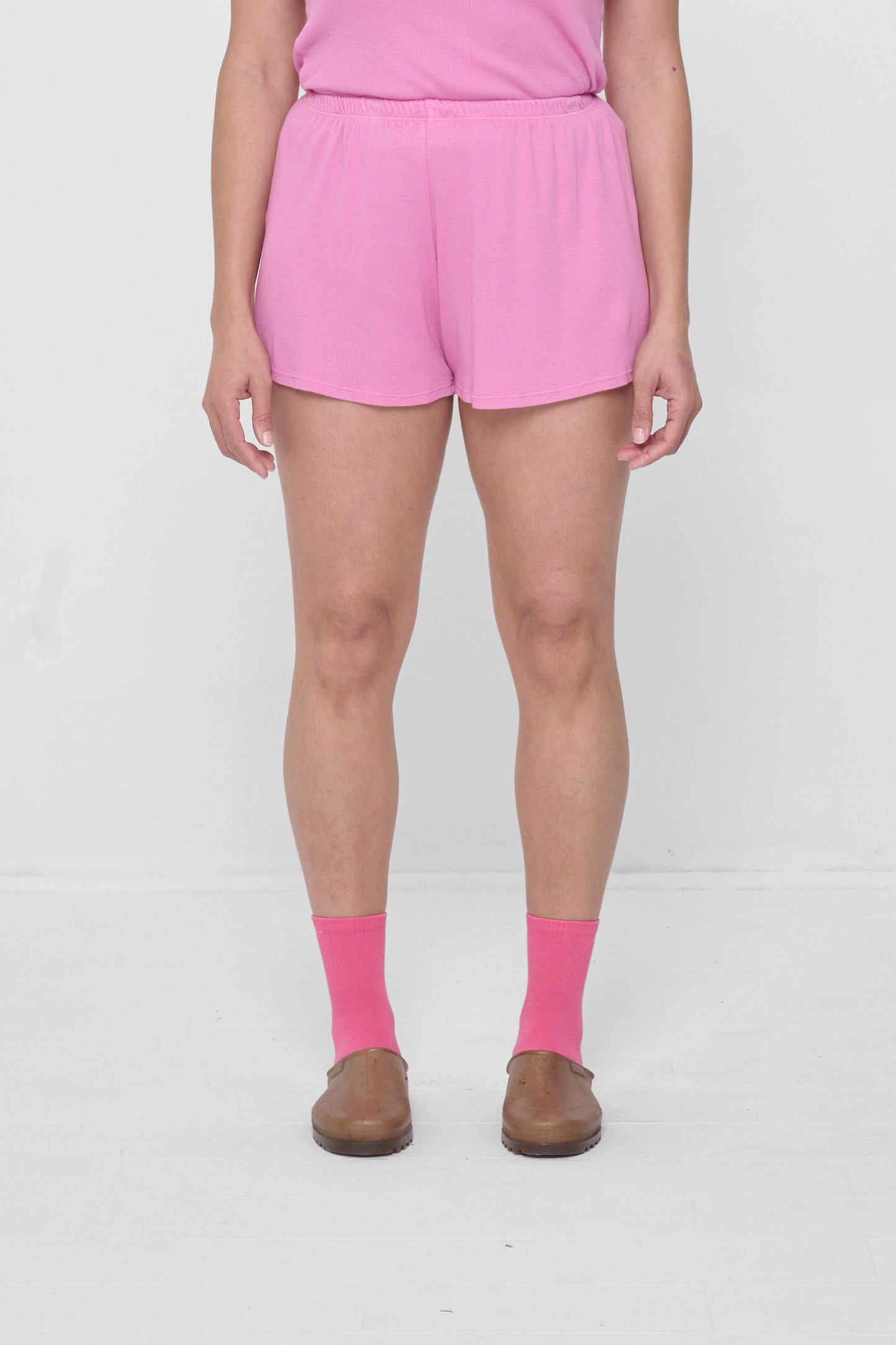 Size M Pixie Rib Shorts on 5'4" model. Relaxed fit, upper-thigh length.