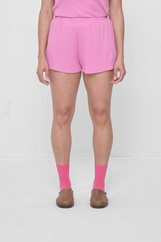 Size M Pixie Rib Shorts on 5'4" model. Relaxed fit, upper-thigh length.