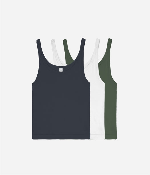 Flat lay of  Rib Tanks in Slate, White, and Pine, partly stacked on each other.