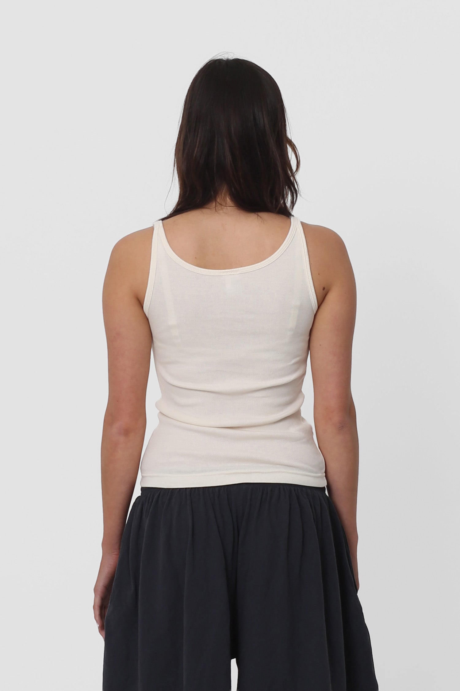 Back view: fitted upper back, relaxed lower back.