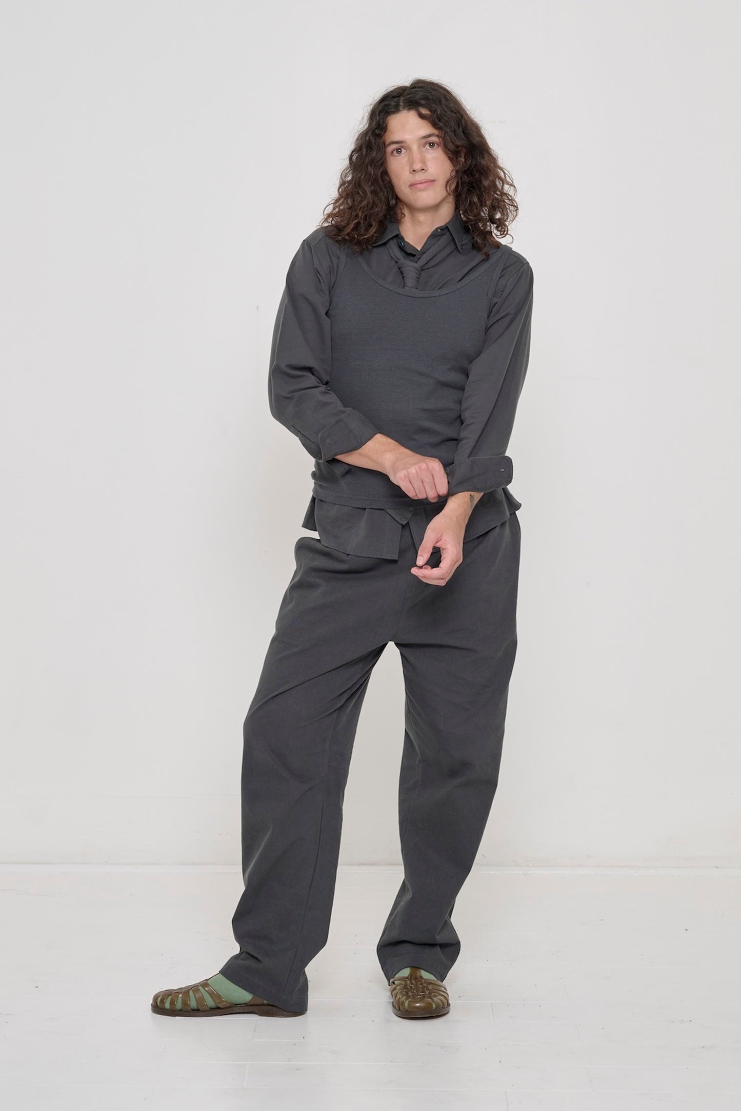 Slate Rib Tank worn as a vest, with all-Slate Life Uniform Pants, Peach Fuzz Cotton Twill Button-up Shirt, and Trash Tie.
