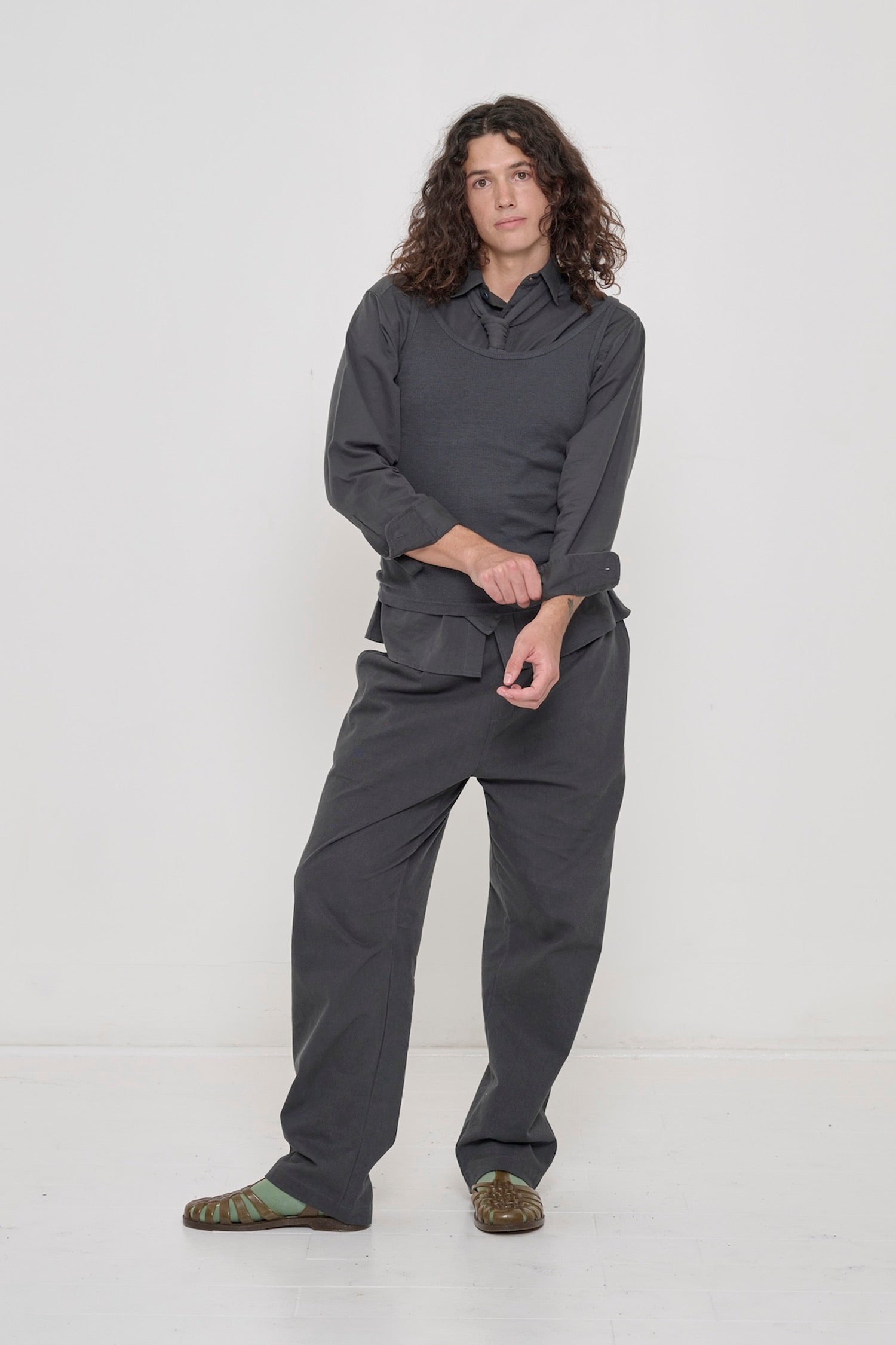 Slate Rib Tank worn as a vest, with all-Slate Life Uniform Pants, Peach Fuzz Cotton Twill Button-up Shirt, and Trash Tie.