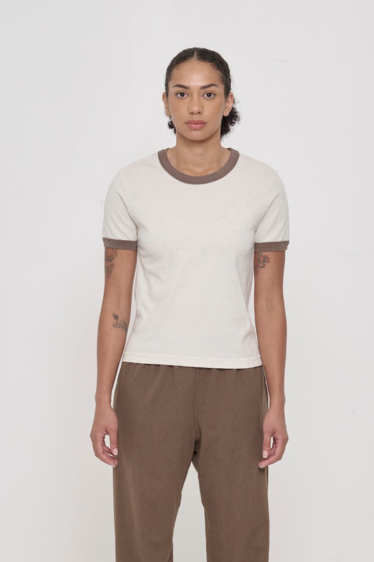 Front view of a 5'8" woman wearing a Ringer Trash Tee in Dry Soil. Hem hits her upper-middle hip.