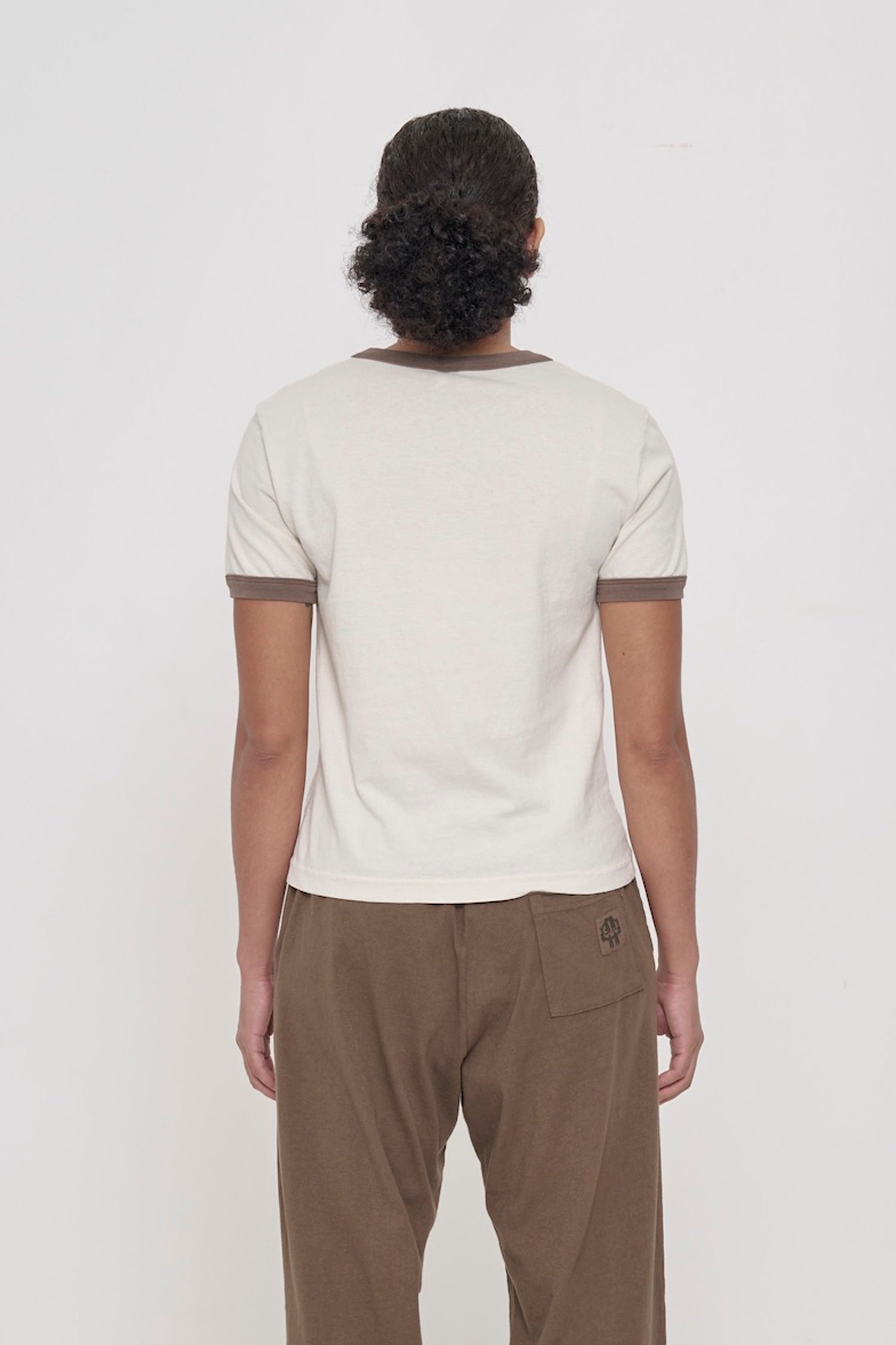 Dry Soil Ringer Trash Tee, back view on a person. Relaxed slim fit throughout.  