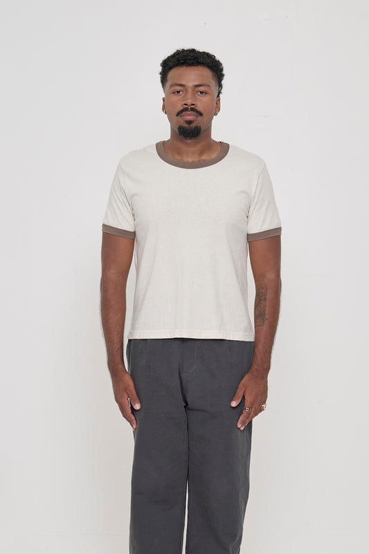 A 6'2" man in a size 2XL Ringer Trash Tee in Dry Soil. Hem hits his upper hip.