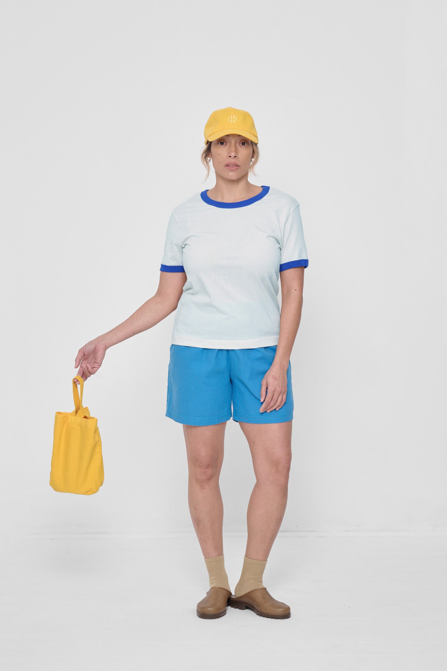 Styled with Malibu Stripe Poplin Everyday Shorts, Everybody Yellow Bucky Logo Cap and Loop Tote.