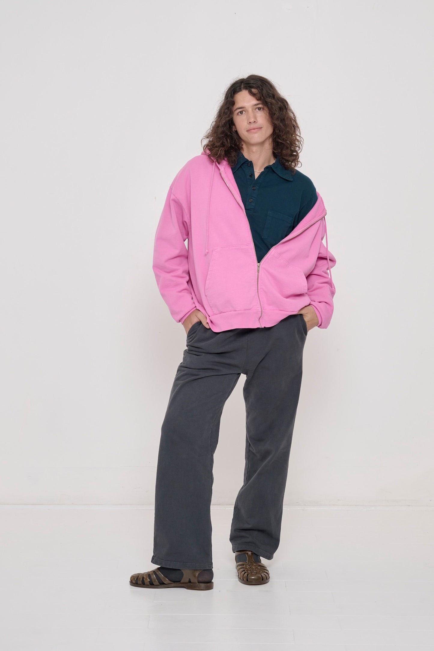 Person wearing Juniper Rugby Trash Polo underneath Pixie Trash Zip Up Hoodie with Slate Trash Fleece Apartment Pants.