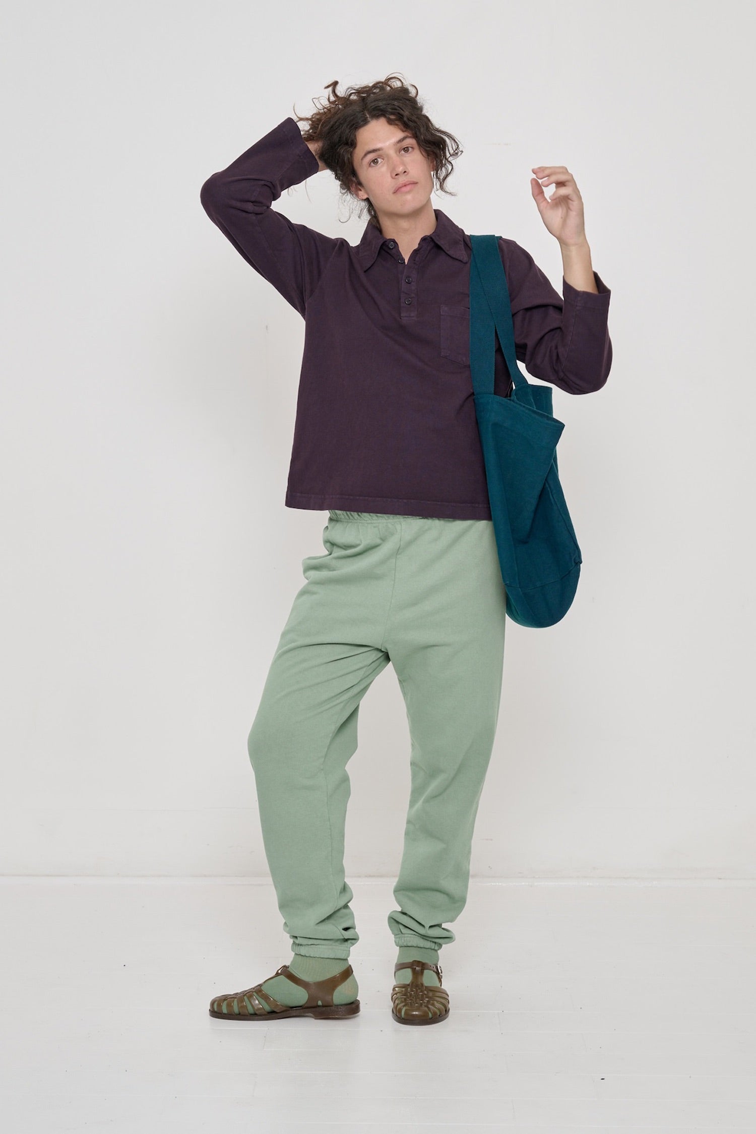 Person wearing Mulberry Rugby Trash Polo with Wasabi Trash Sweatpants and Juniper Big Tote. 