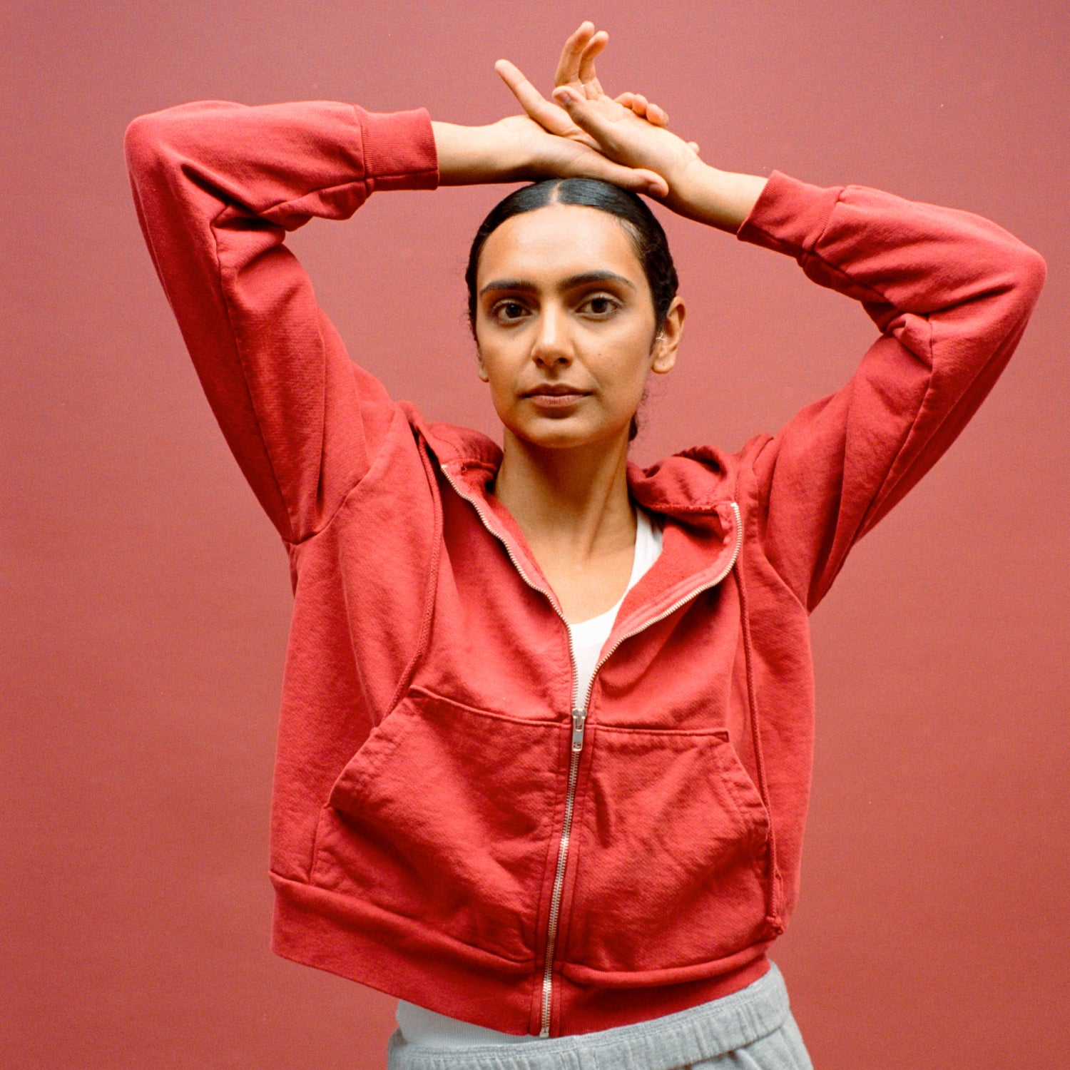 Model pictured in a Cedar Trash Zip Up Hoodie