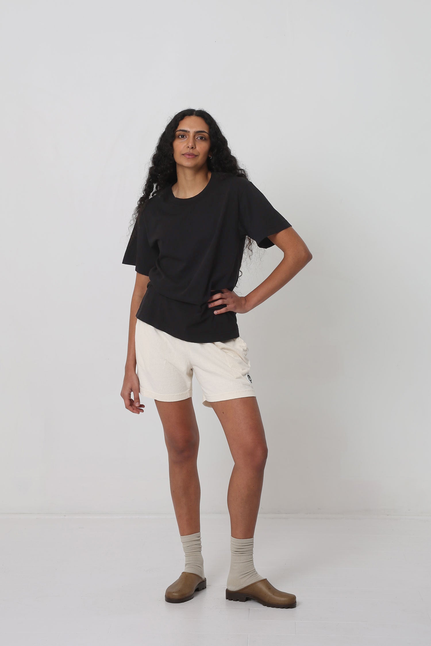 Styled with Scour Everyday Shorts, Oat Squishy Socks and Plasticana Opana Mules.