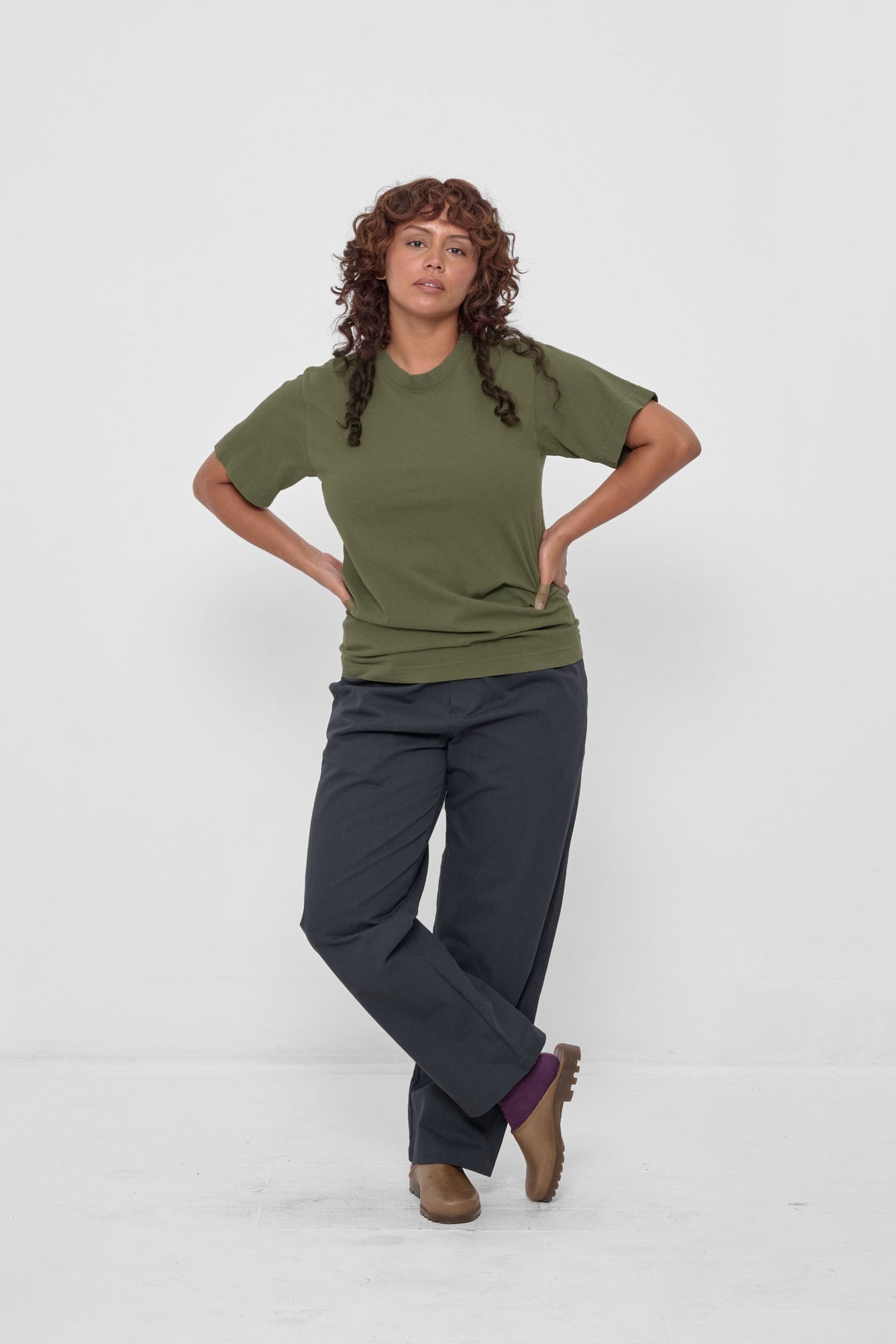 Short Sleeve Trash Tee in Olive – styled with Slate Life Uniform Pants, Washed Mulberry Squishy Socks, and Plasticana Mules