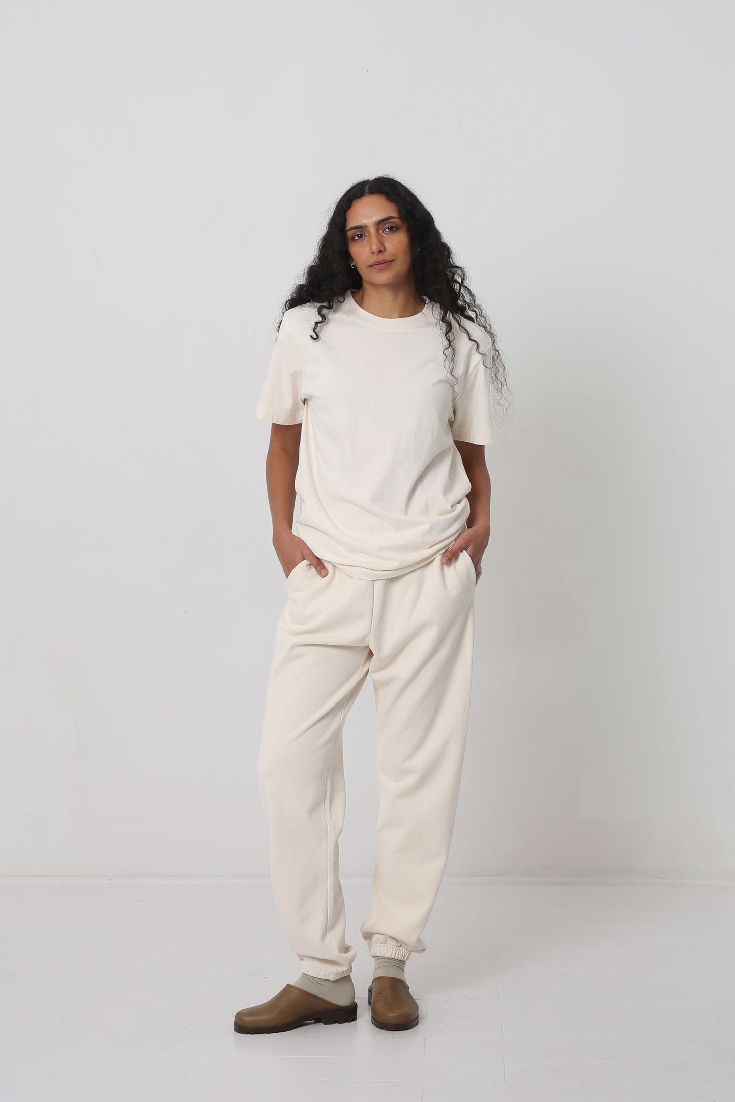 Styled with Scour Trash Sweatpants, Oat Squishy Socks and Plasticana mules.