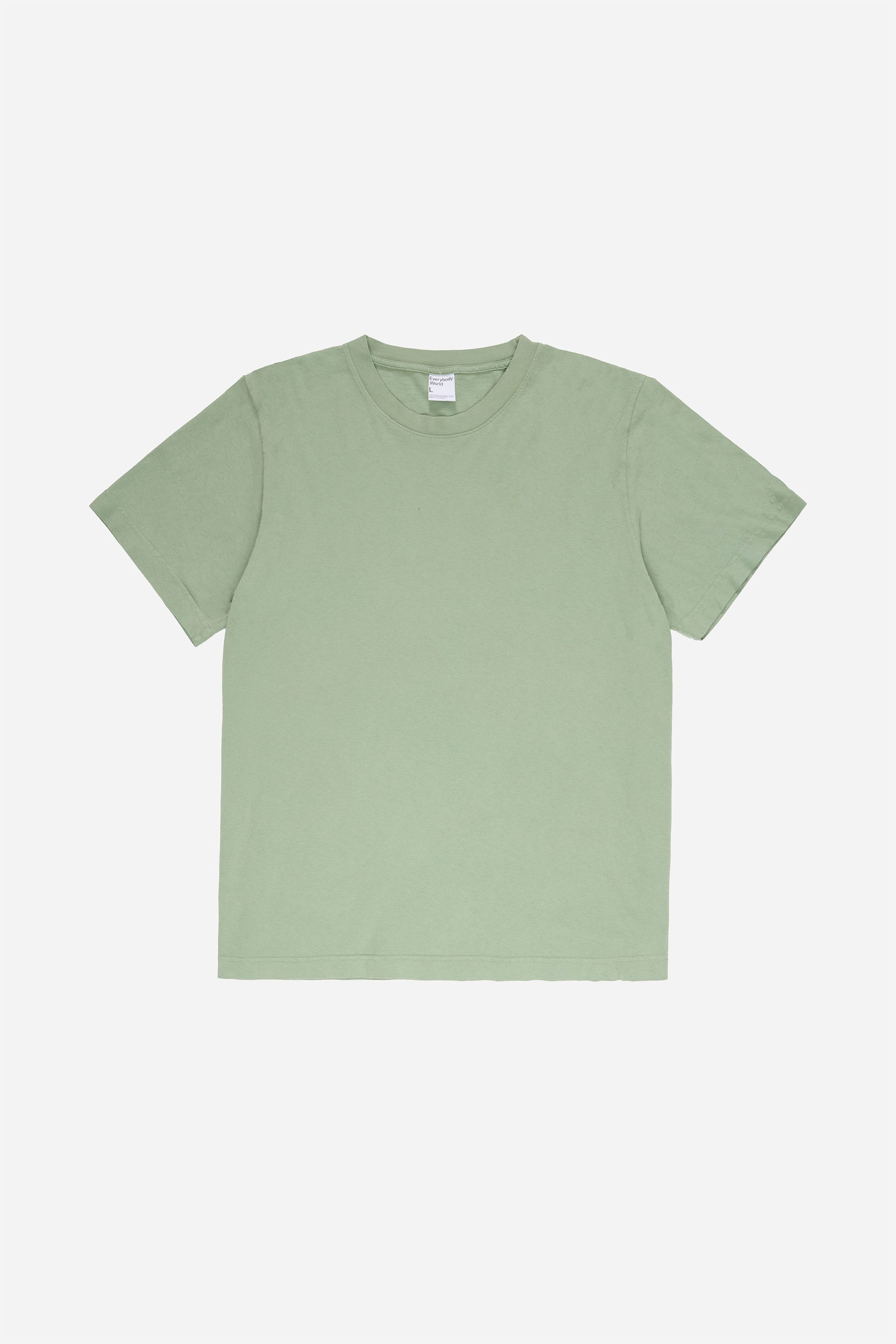 Flat lay of the Short Sleeve Trash Tee in Wasabi, showing the classic cut of the light green garment.