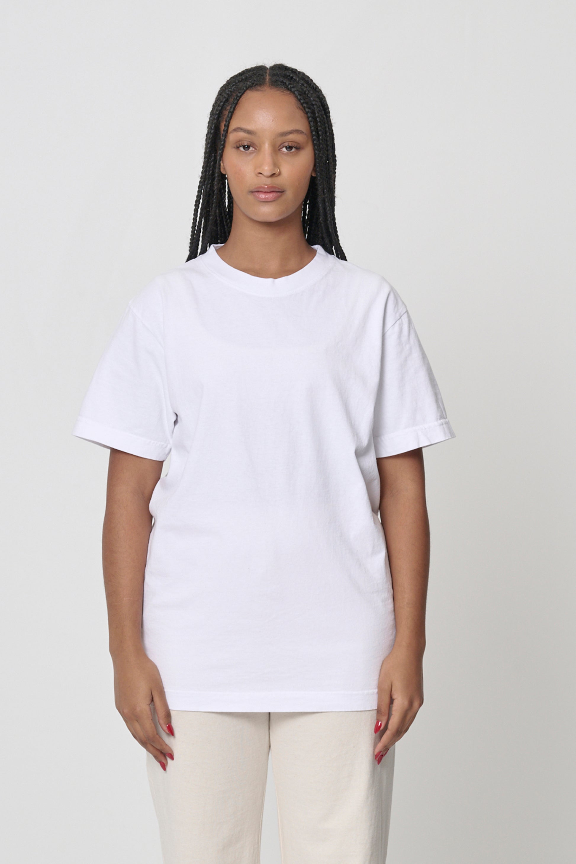 Front view of a woman wearing the Short Sleeve Trash Tee in Scour, showcasing its relaxed fit.