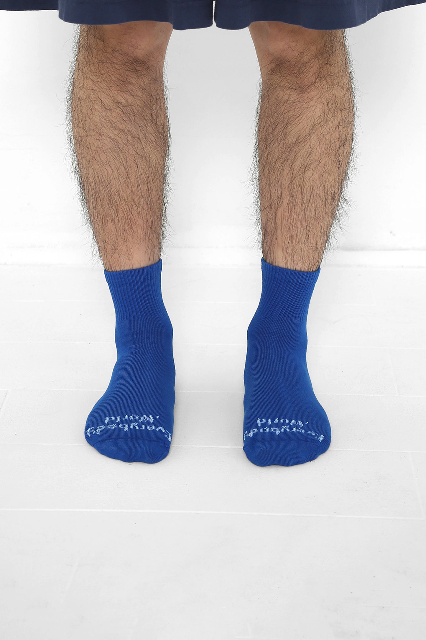 Lapis Spring Socks, branded 'Everybody.World' in white, ankle-high, shown on lower legs.