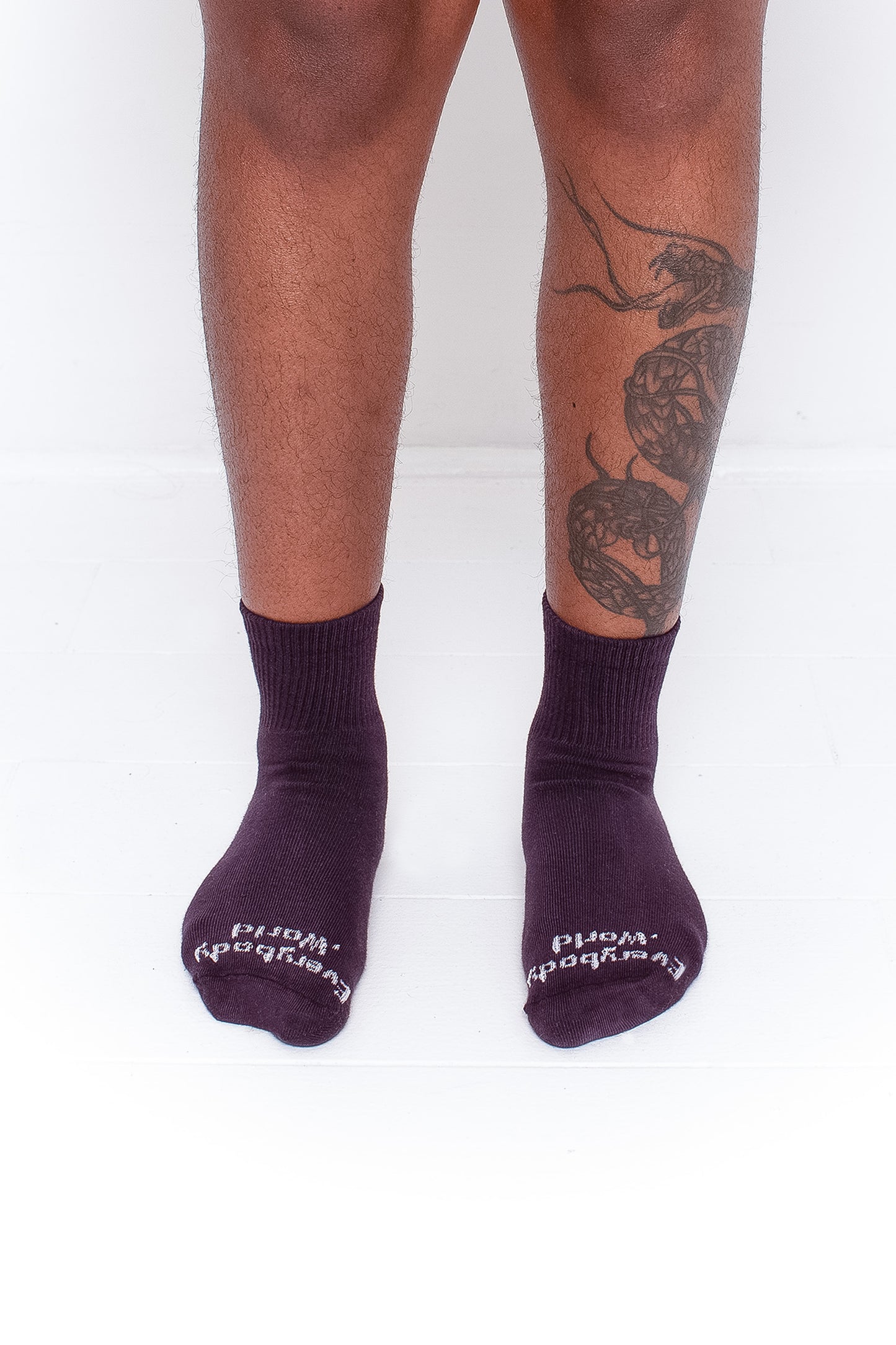 Mulberry Spring Socks, branded 'Everybody.World' in white, are ankle-high, shown on a person's lower legs.